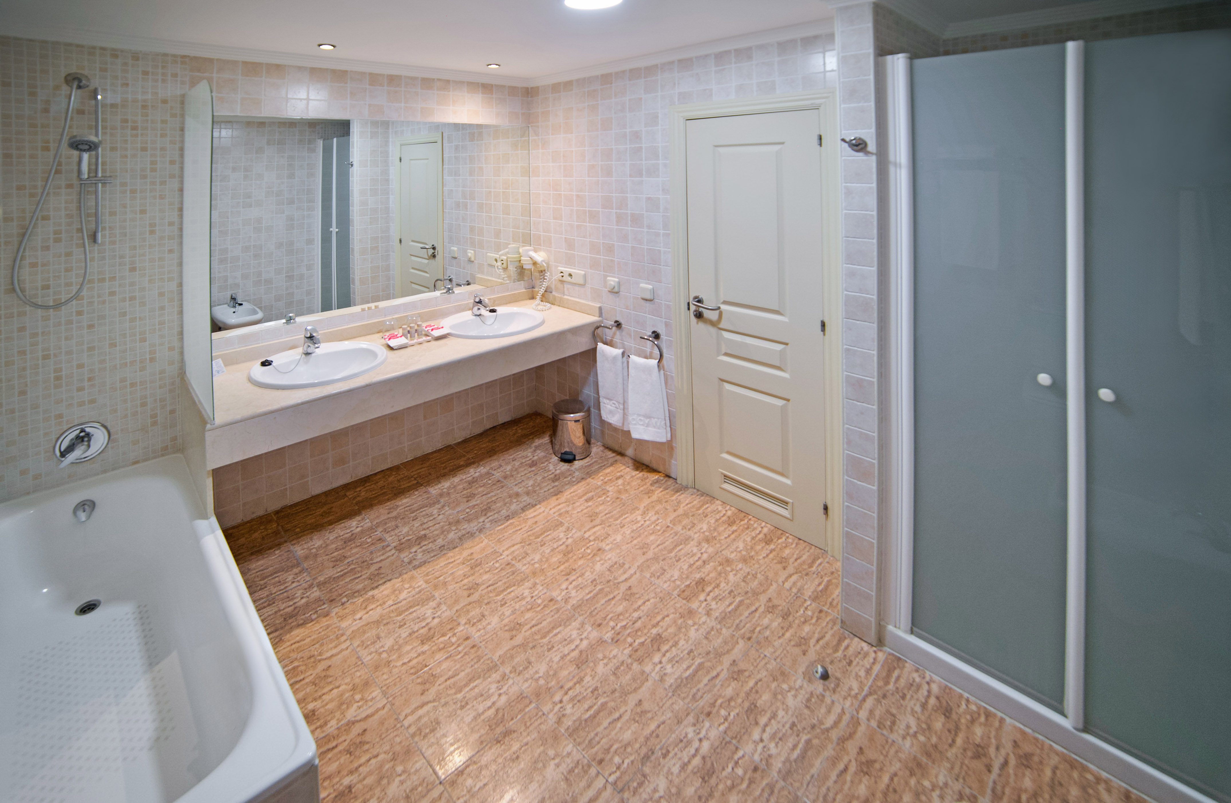 a bathroom with a shower and sink