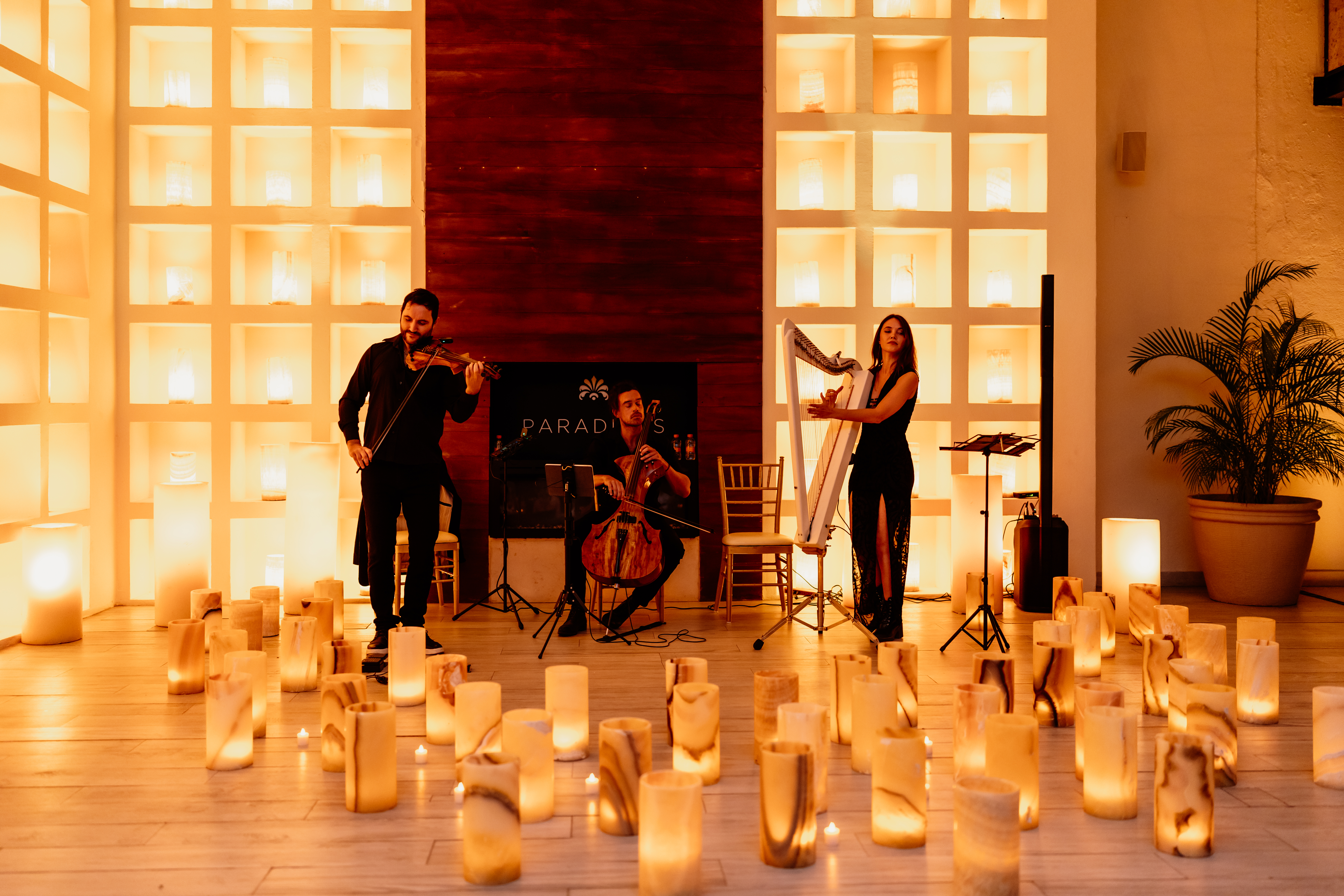 a group of people playing instruments and a group of people on a stage