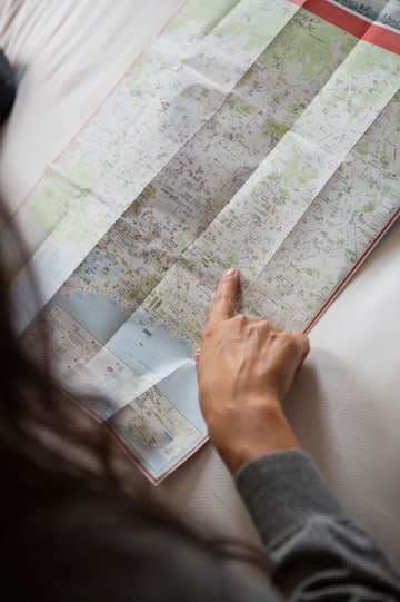 a person pointing at a map