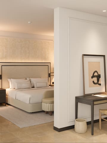 a bedroom with a bed and a desk