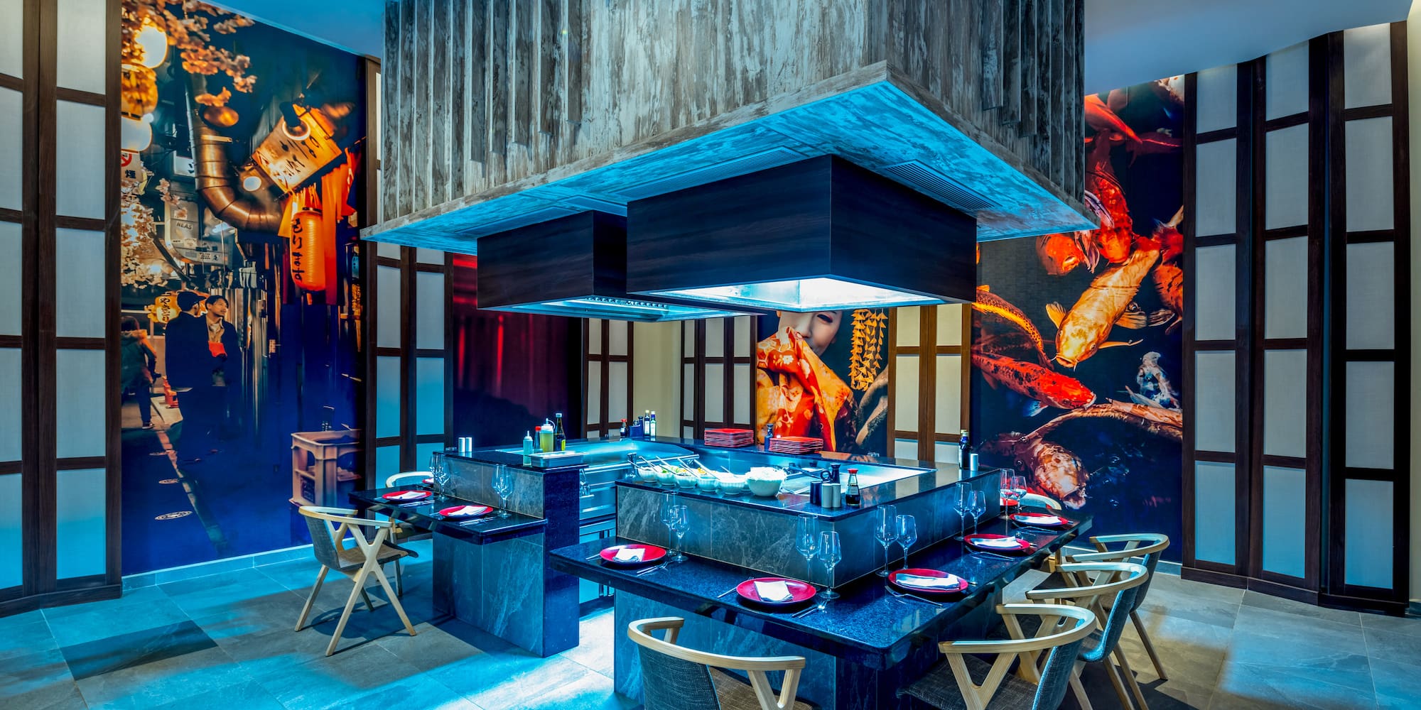 a restaurant with a large table and chairs