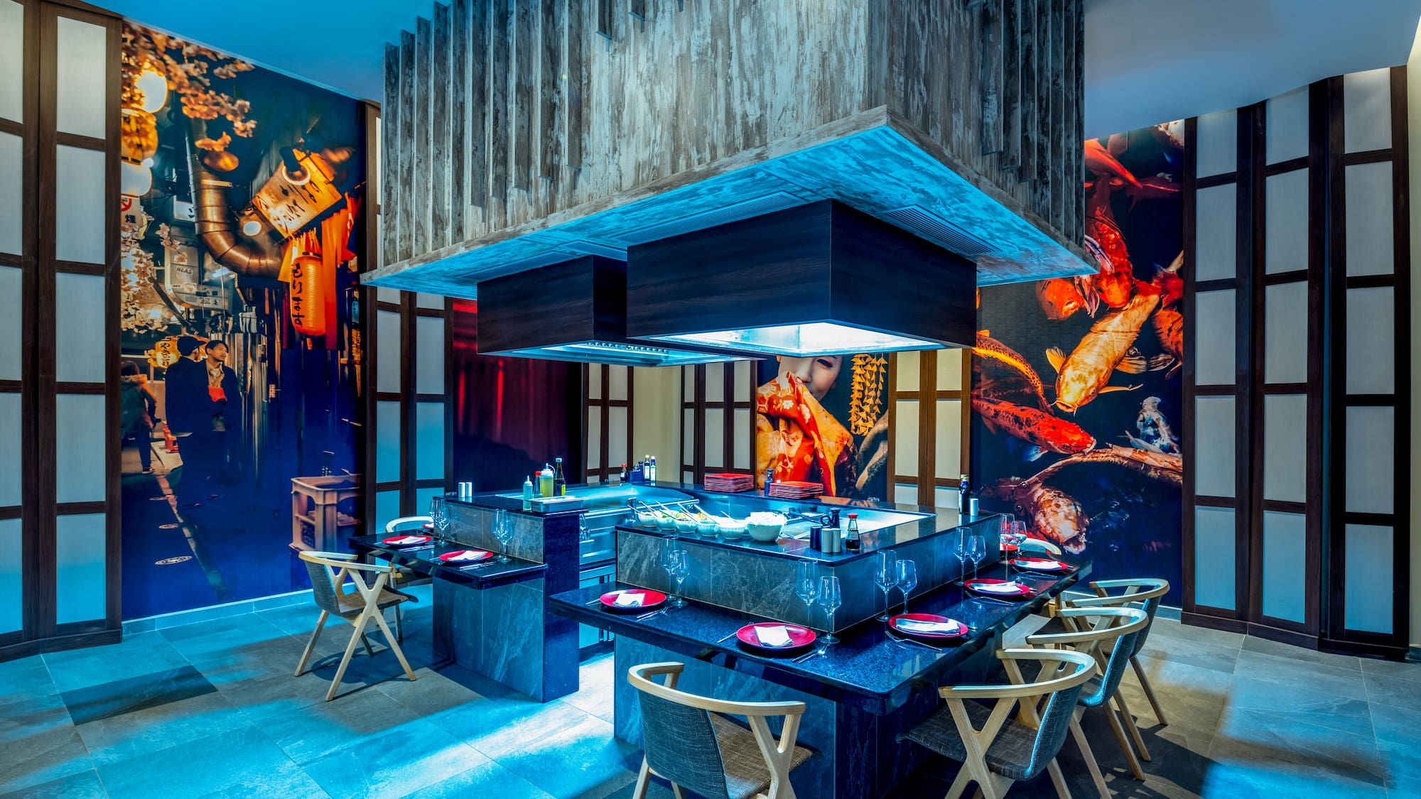 a restaurant with a large table and chairs