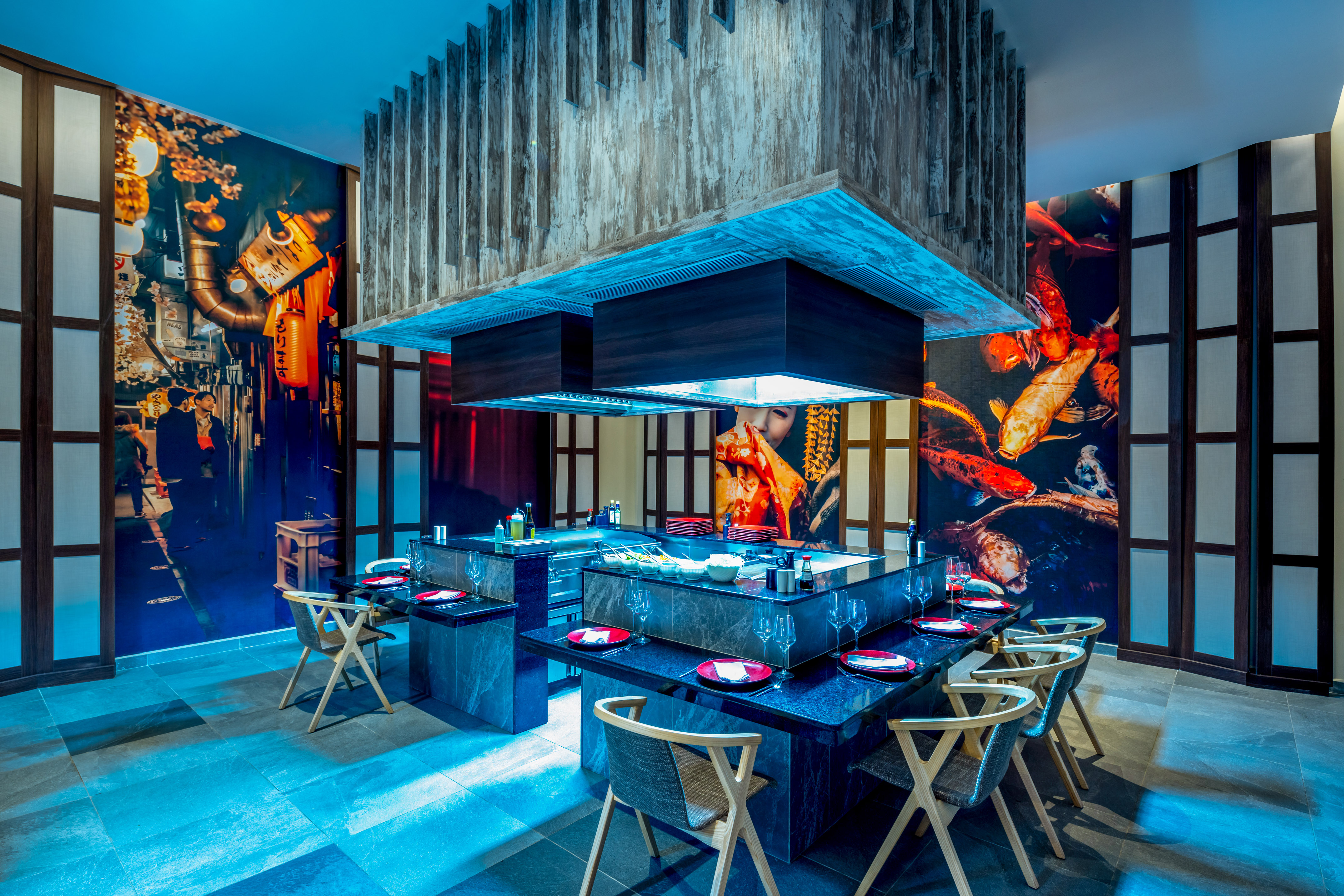 a restaurant with a large table and chairs