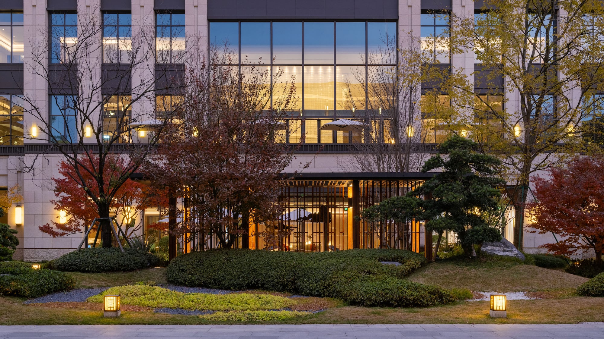 a building with trees and bushes