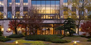 a building with trees and bushes