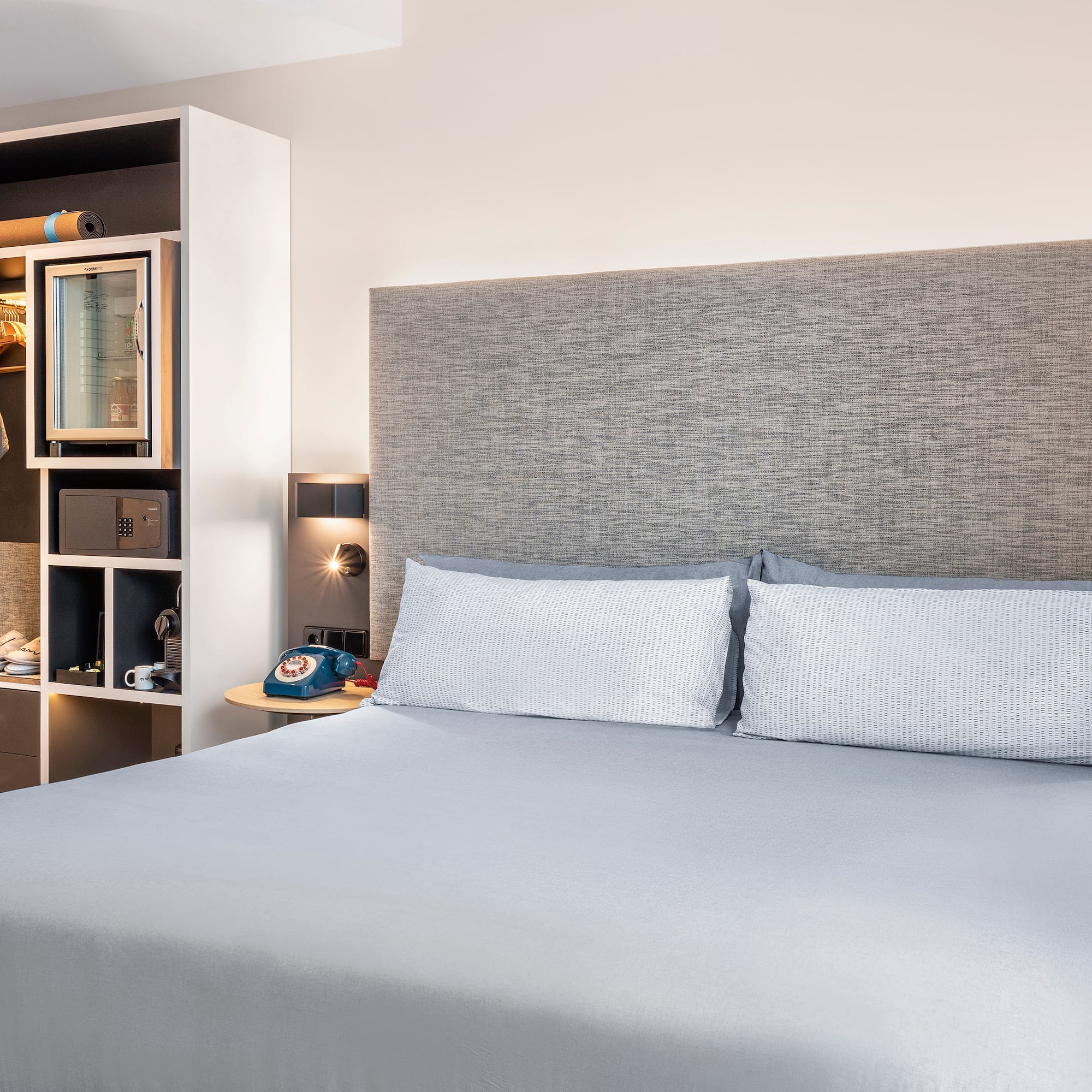 a bed with a headboard and a shelf