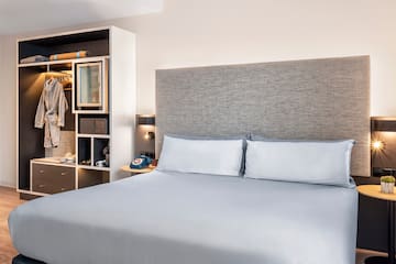 a bed with a headboard and a shelf