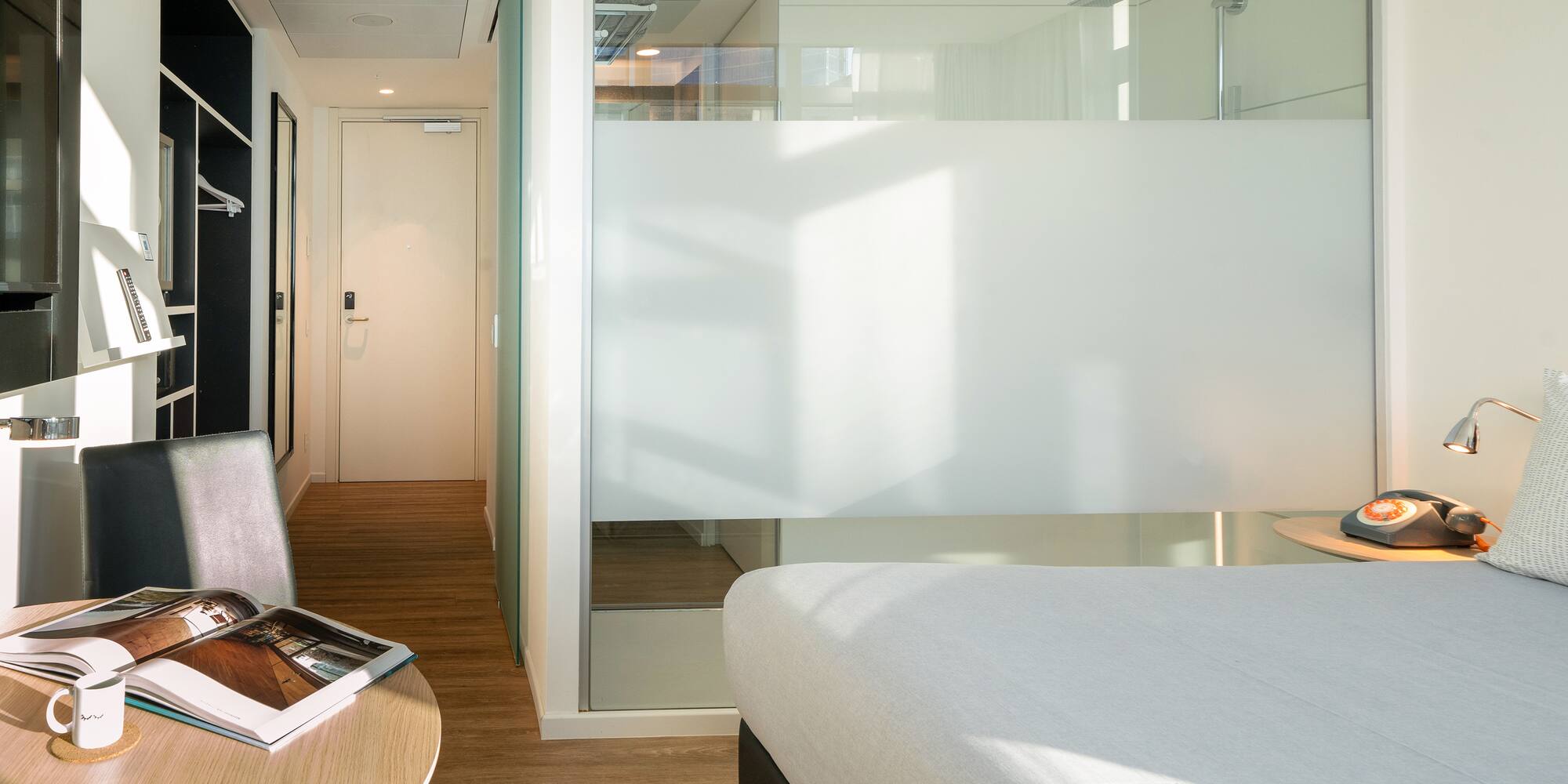 a room with a bed and a desk