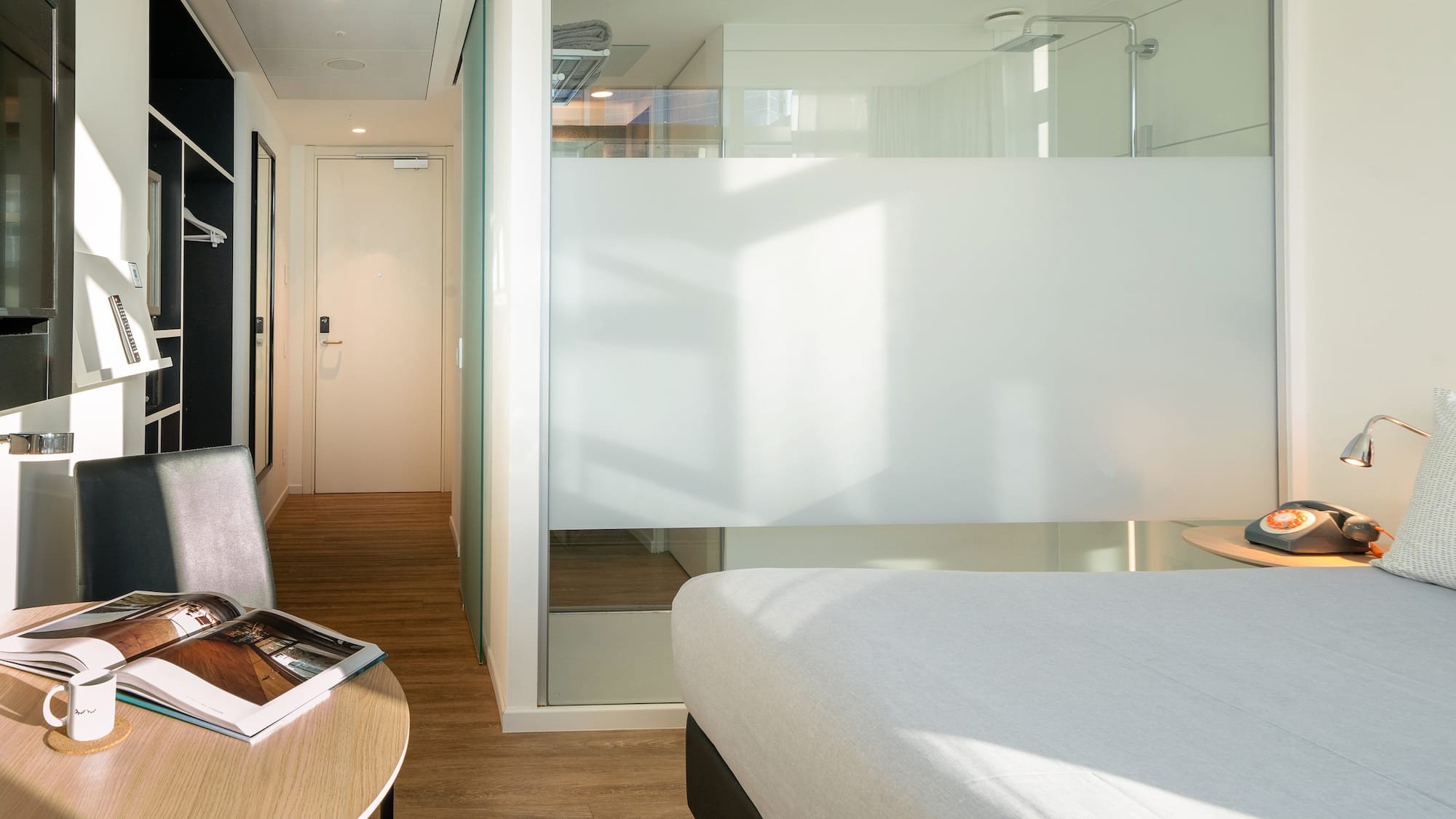 a room with a bed and a desk