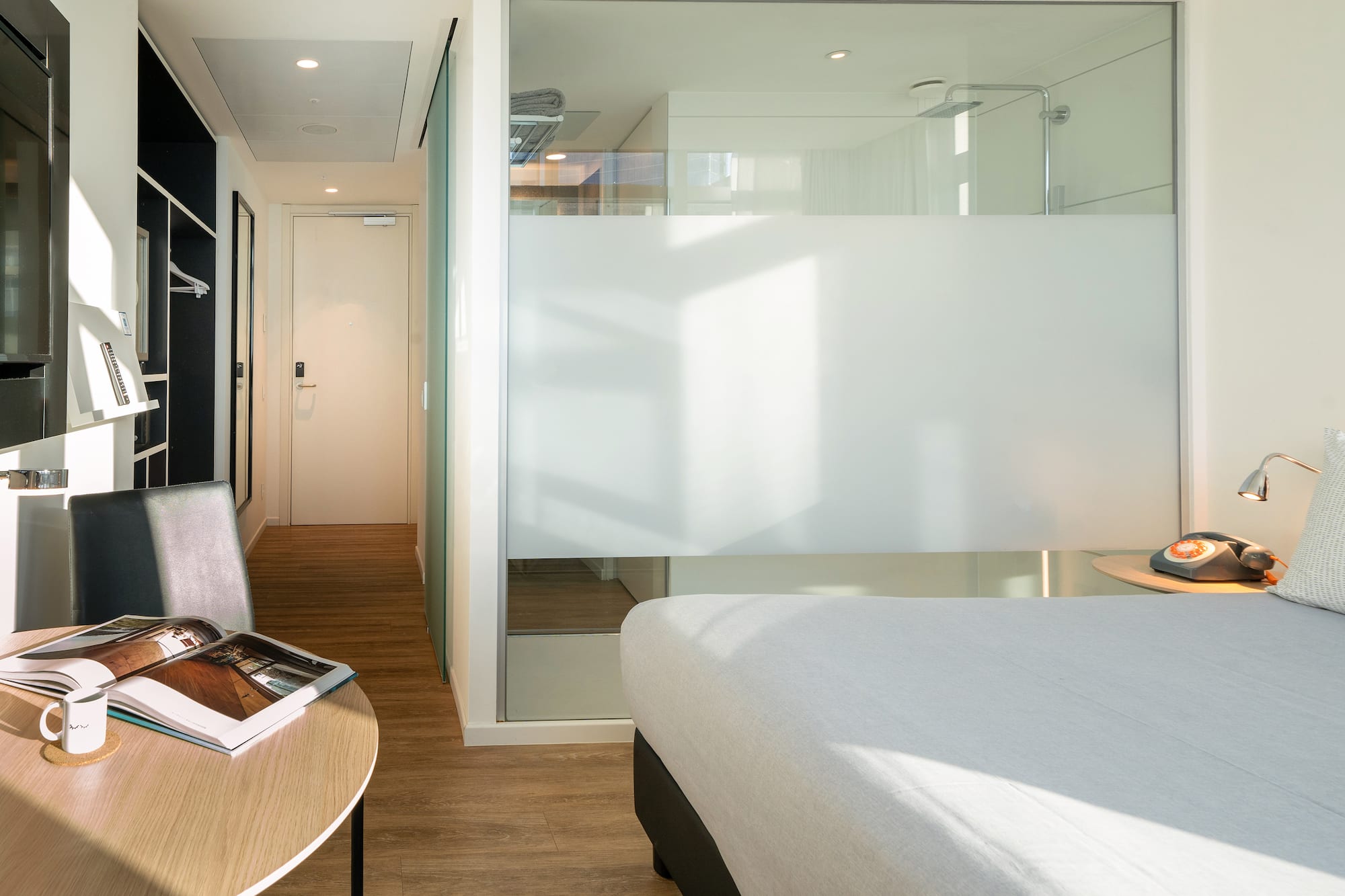 a room with a bed and a desk