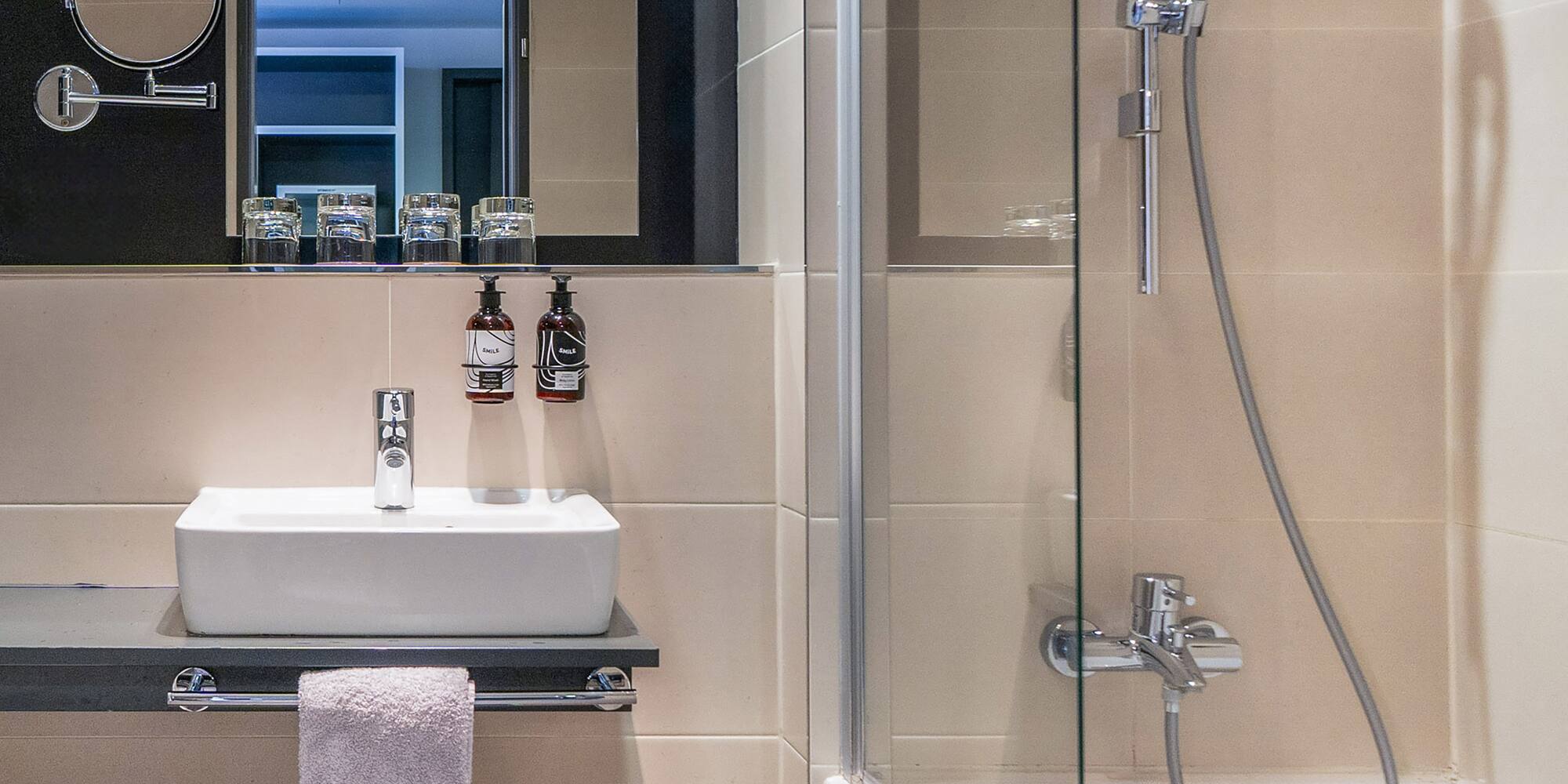 a bathroom with a shower and sink