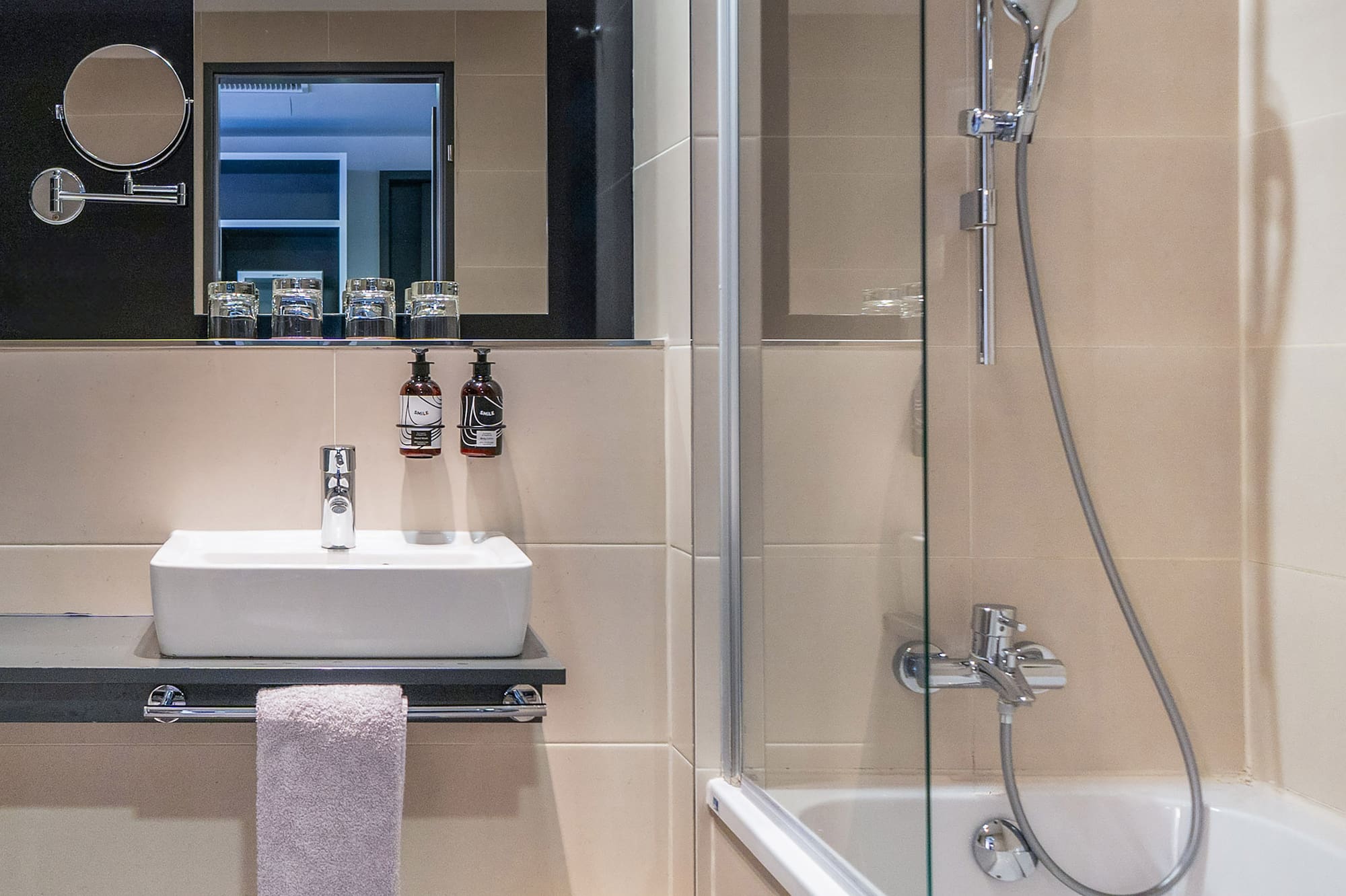 a bathroom with a shower and sink