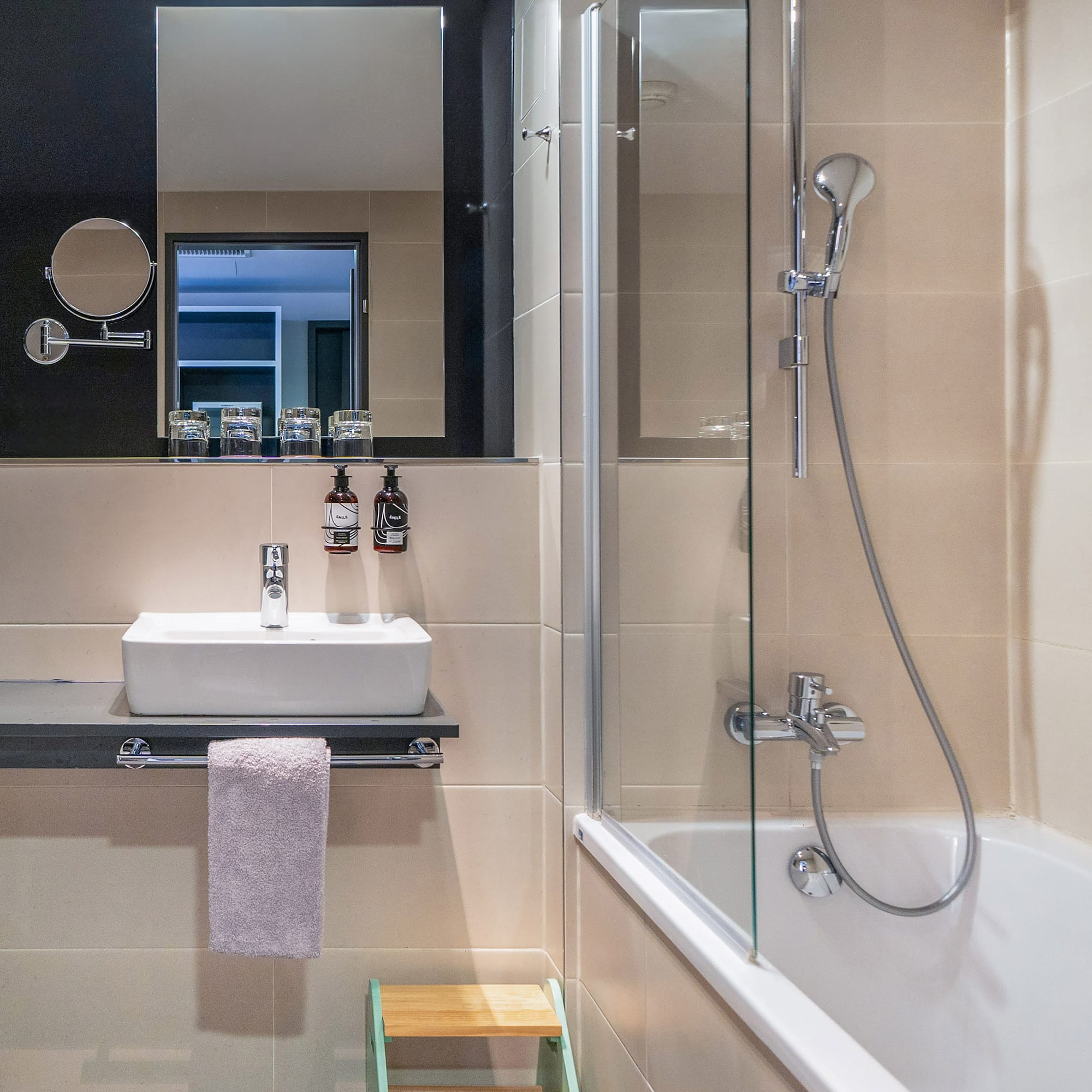 a bathroom with a shower and sink