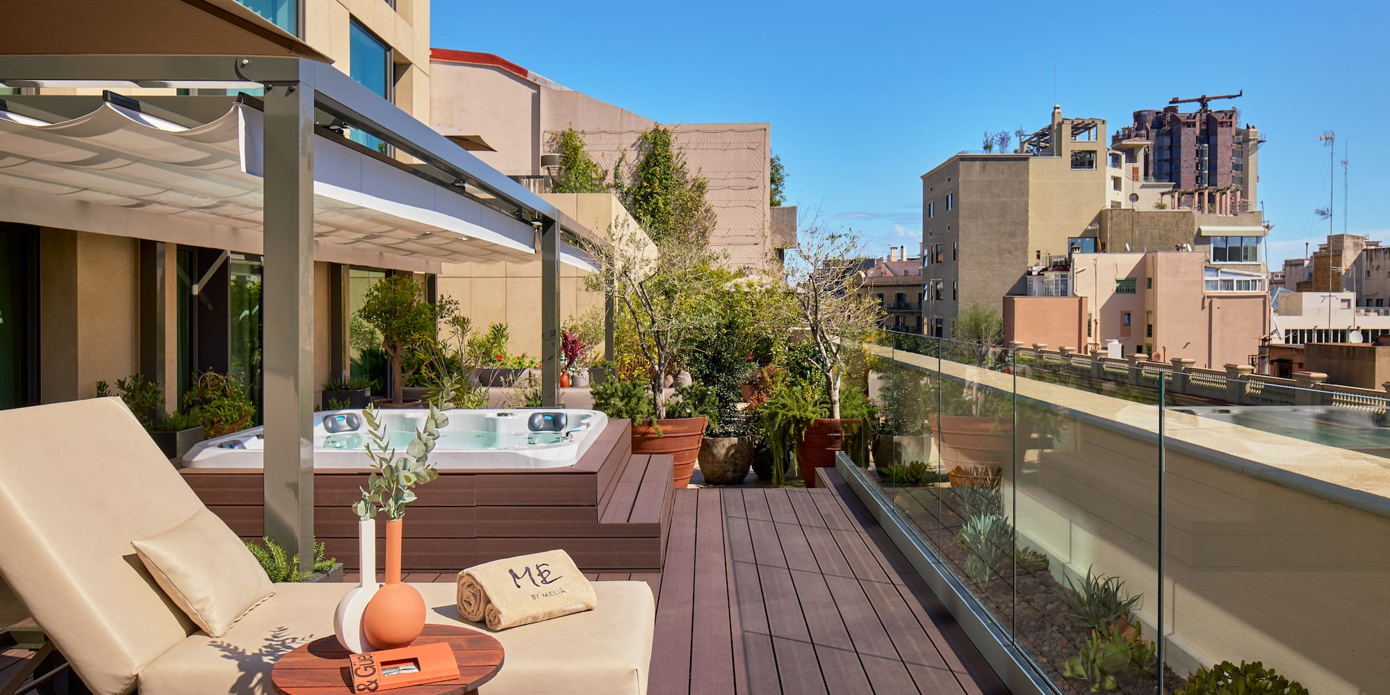 a patio with a hot tub and a table