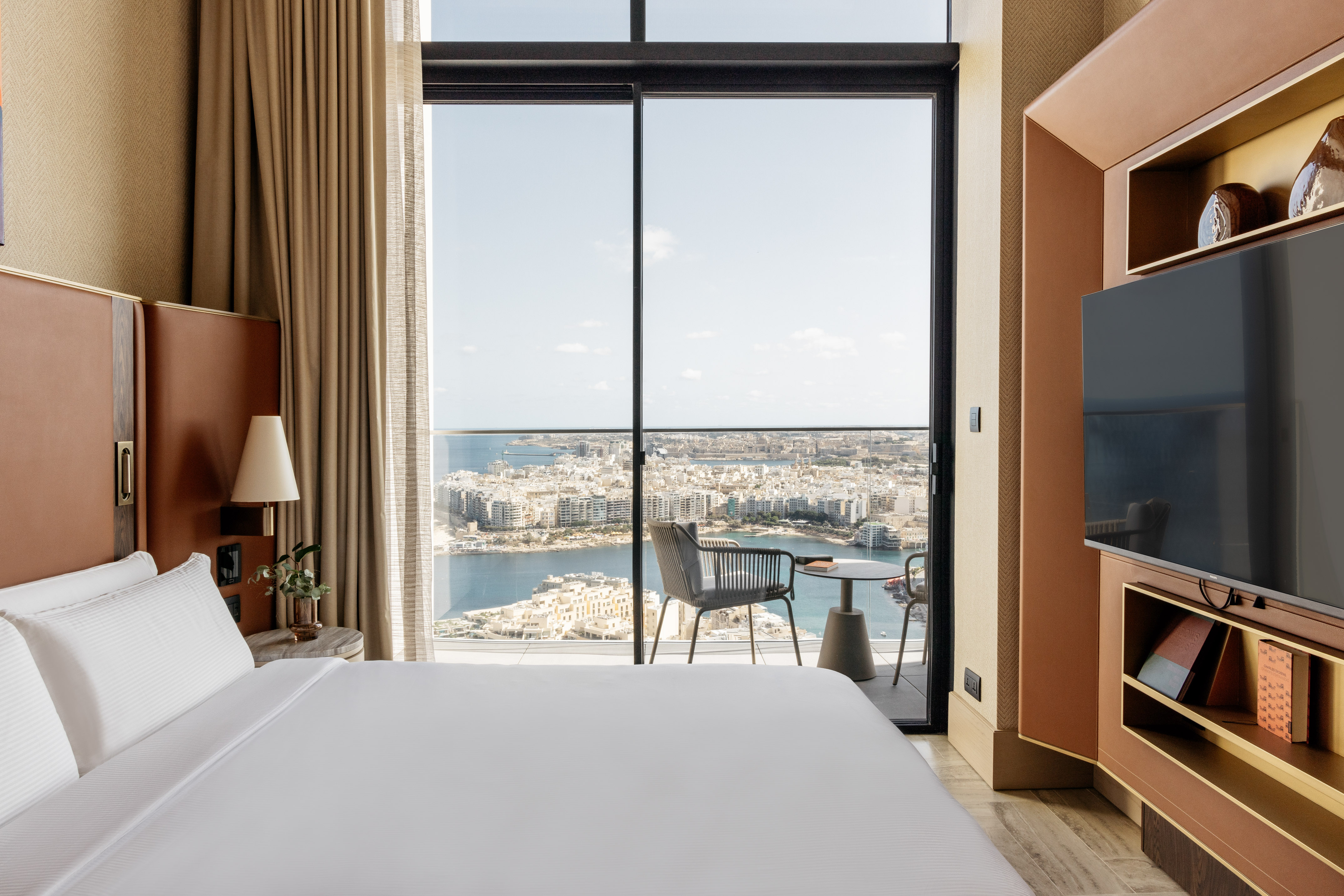 a room with a large window overlooking a city