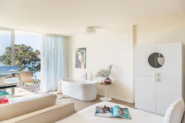 a room with a tub and a couch