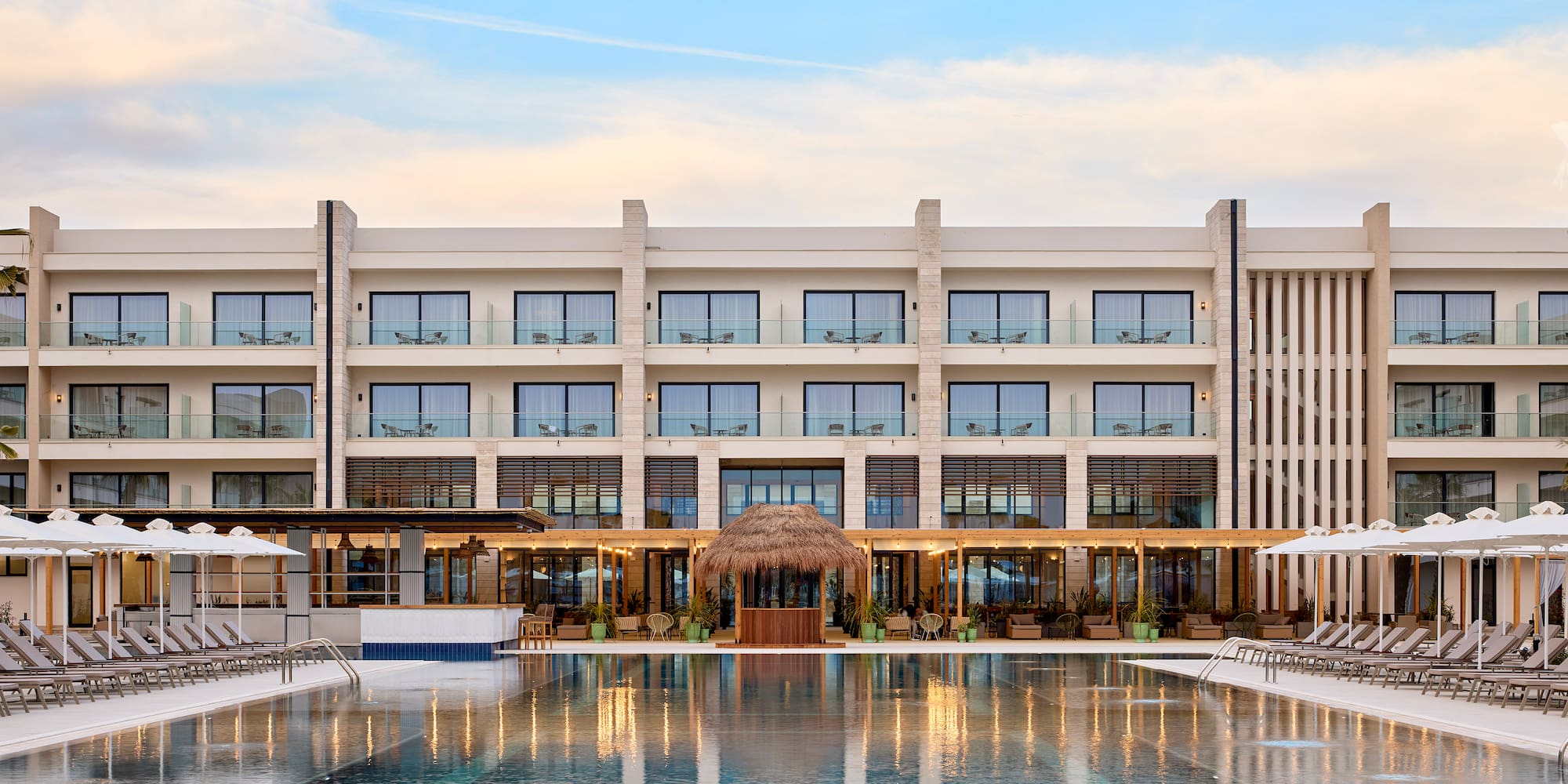 a building with a pool and a building with windows