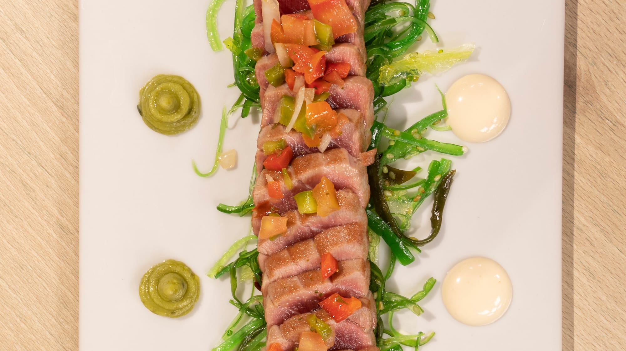 a plate of food on a wood table