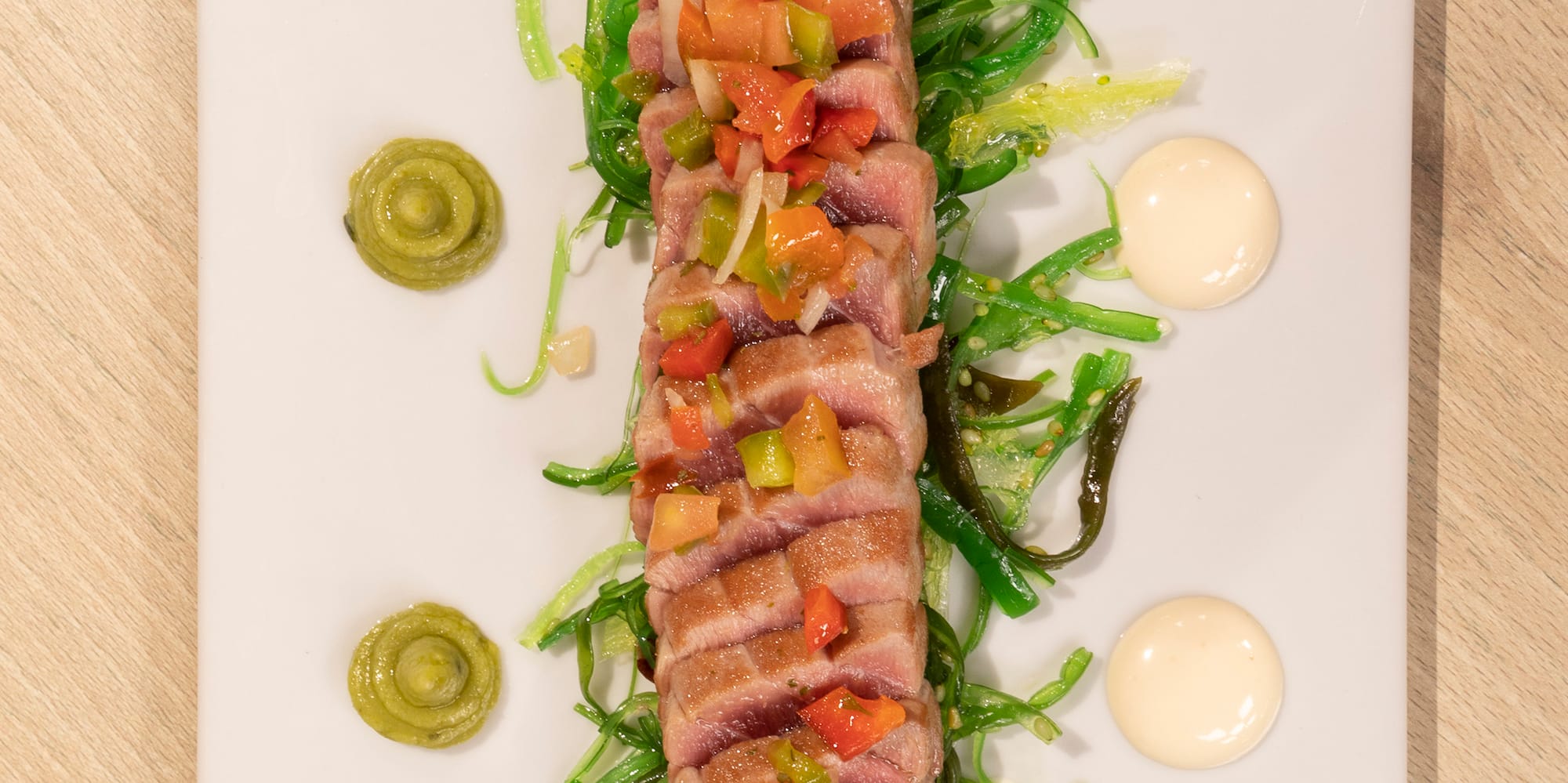 a plate of food on a wood table
