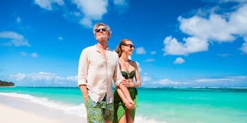 a man and woman on a beach