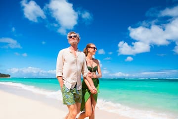 a man and woman on a beach