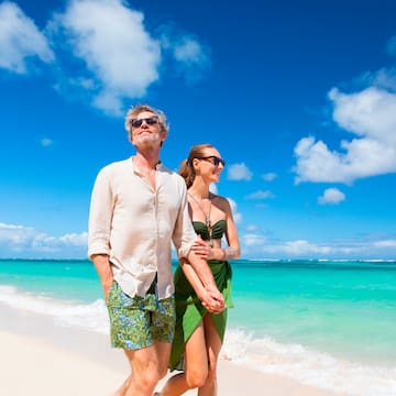 a man and woman on a beach