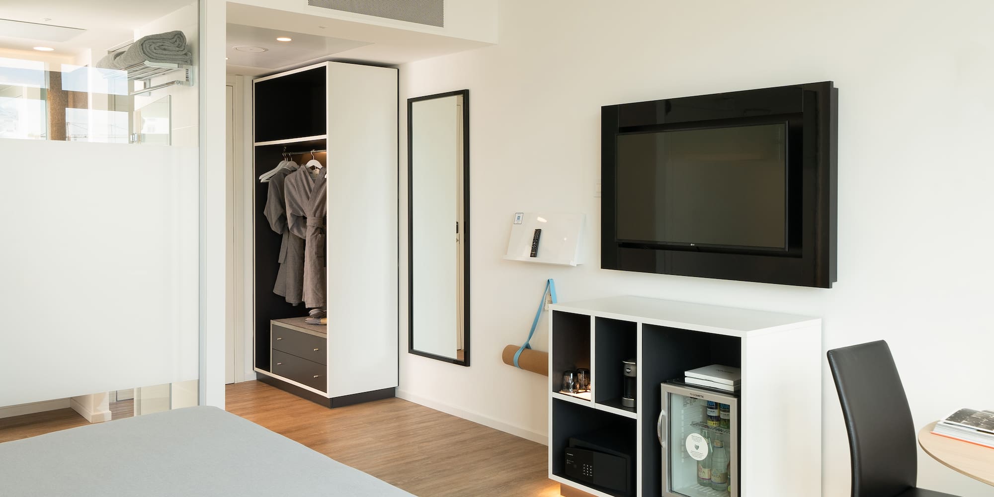 a room with a tv and a closet