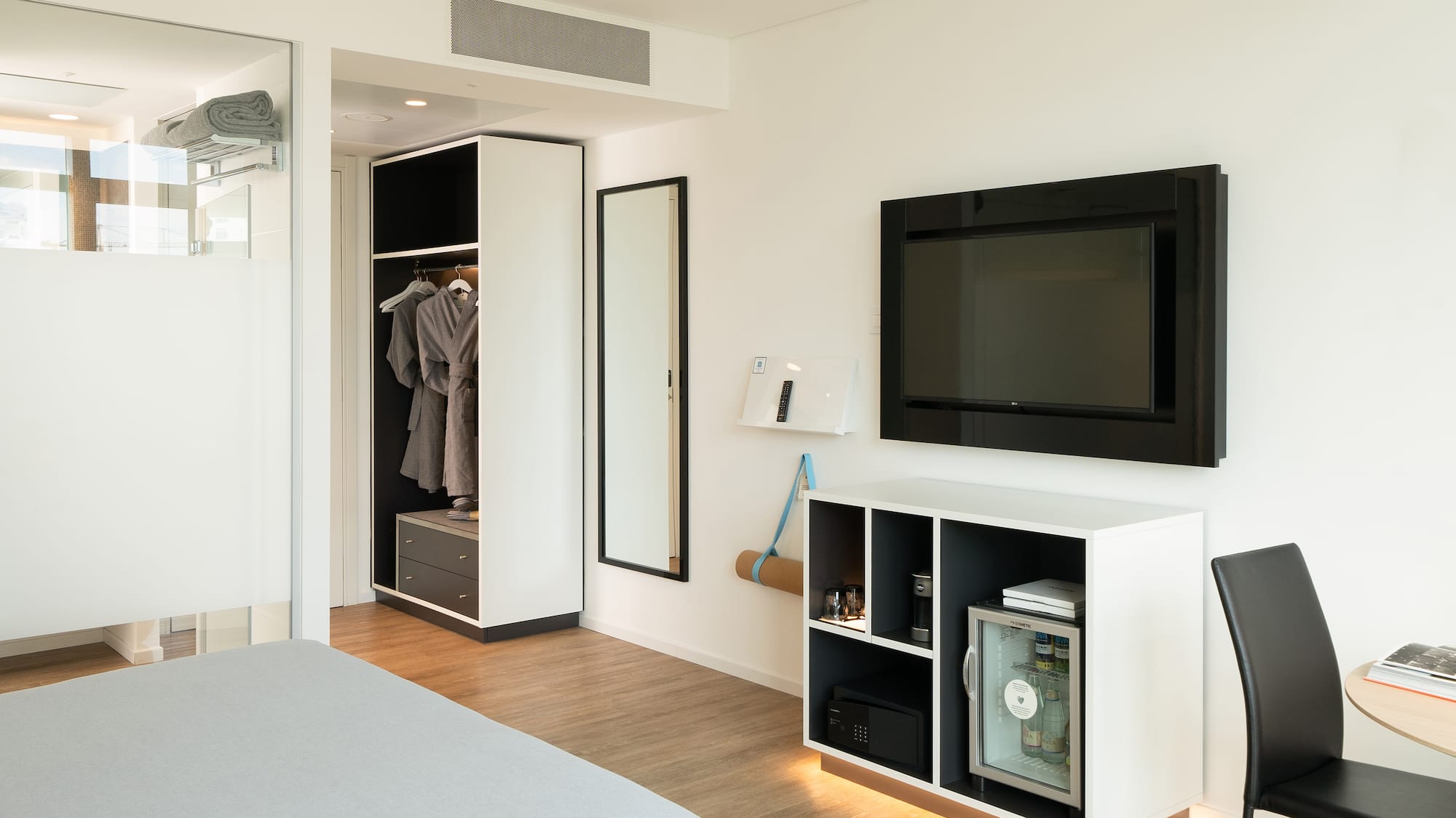 a room with a tv and a closet