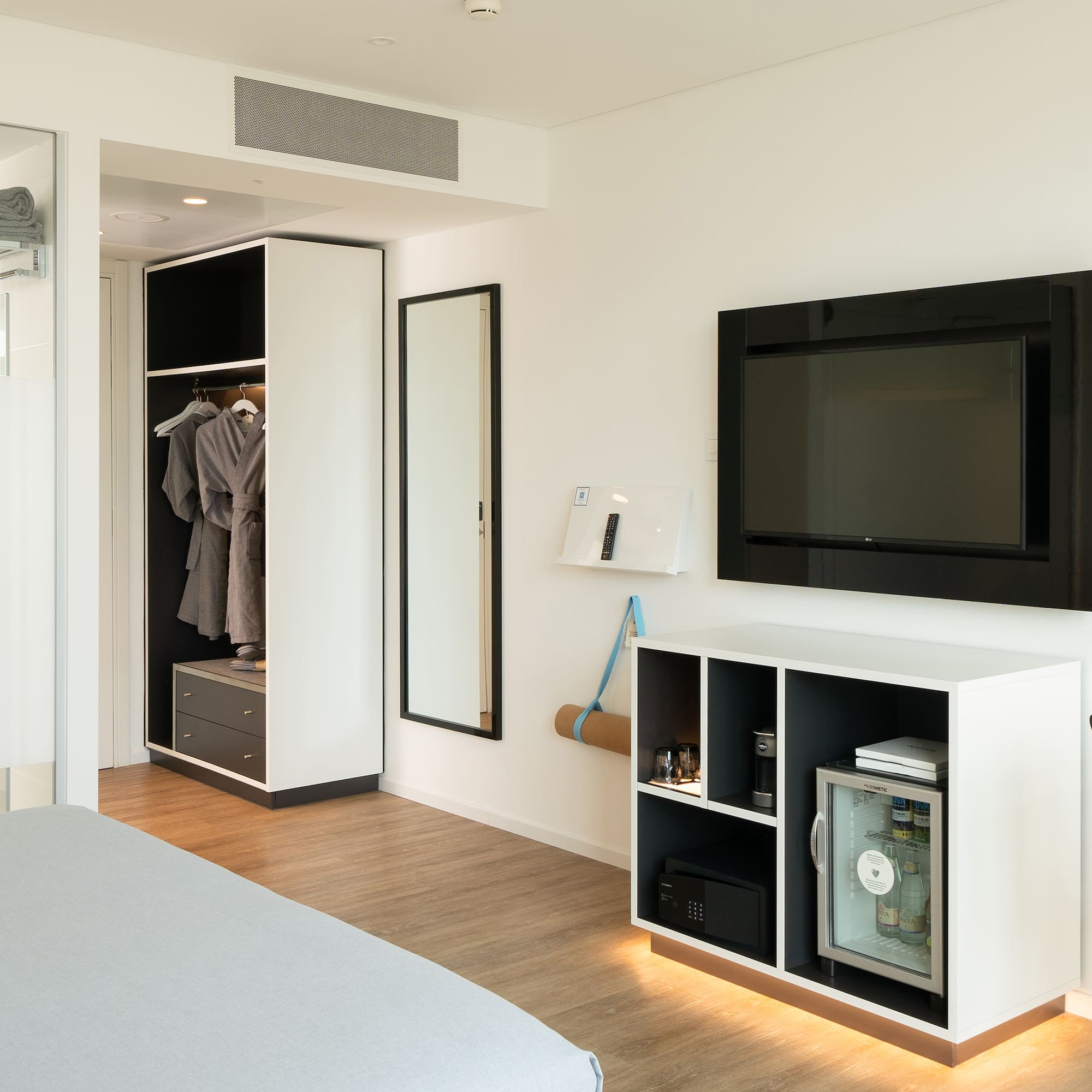 a room with a tv and a closet
