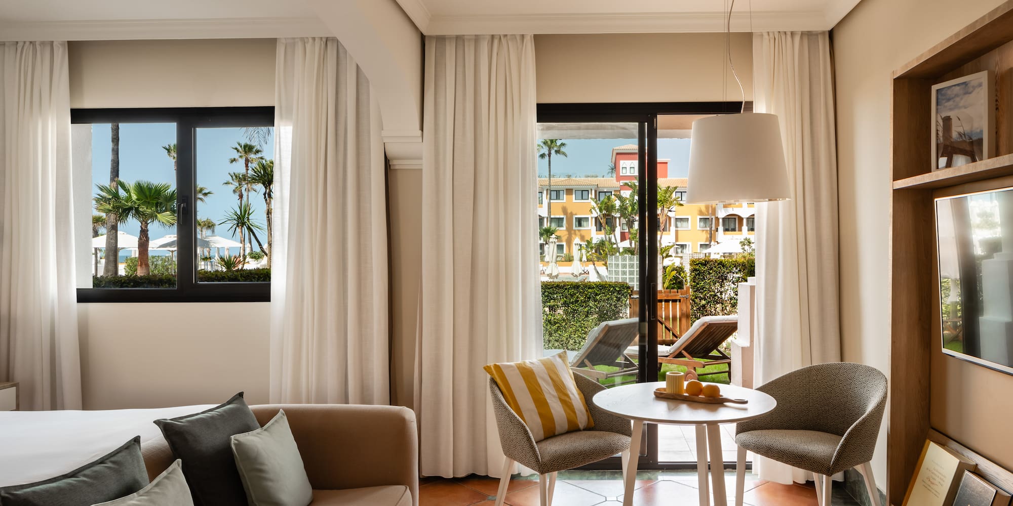 a living room with a couch and chairs