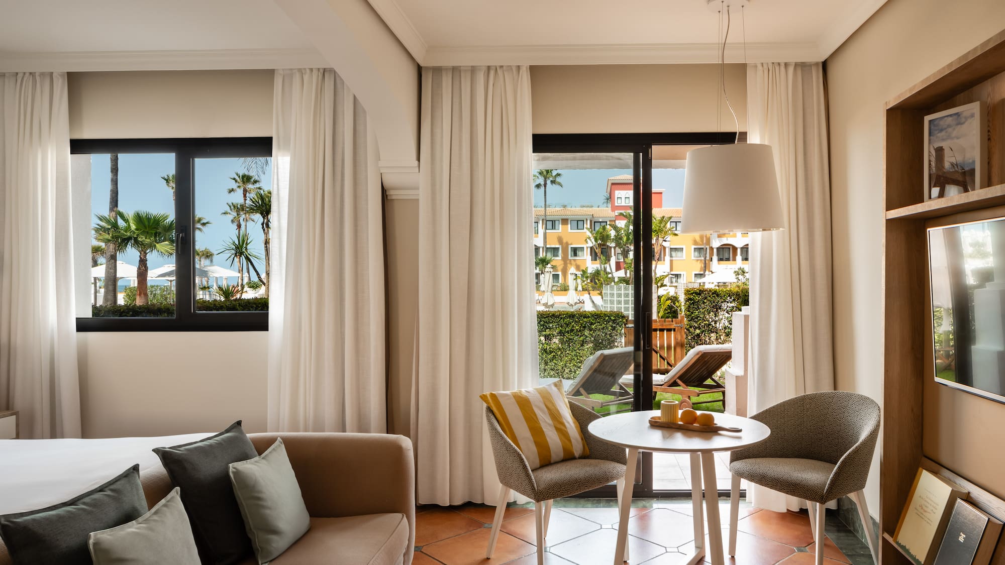 a living room with a couch and chairs