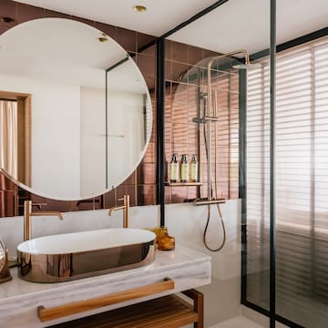 a bathroom with a sink and shower