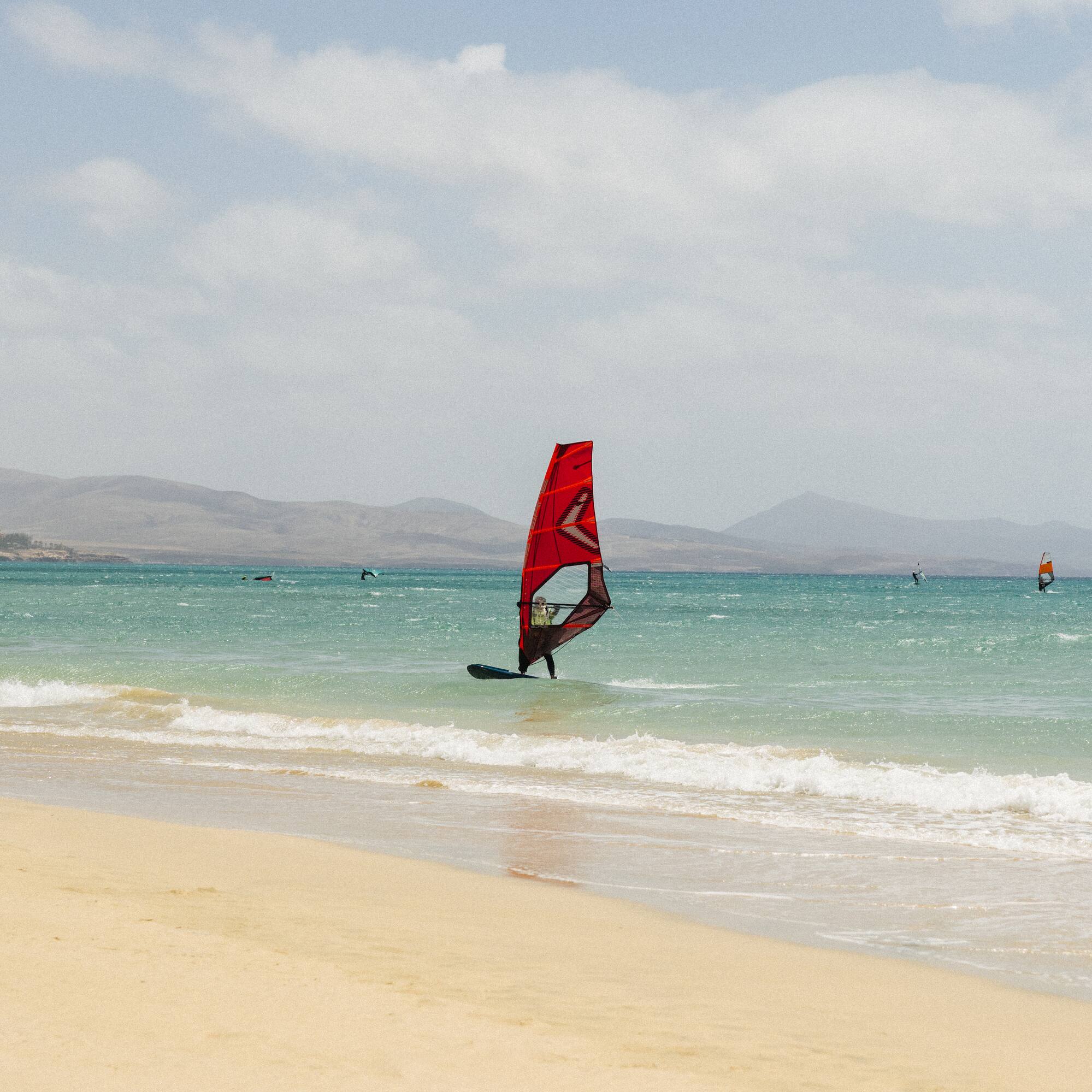 a person on a sailboat in the water