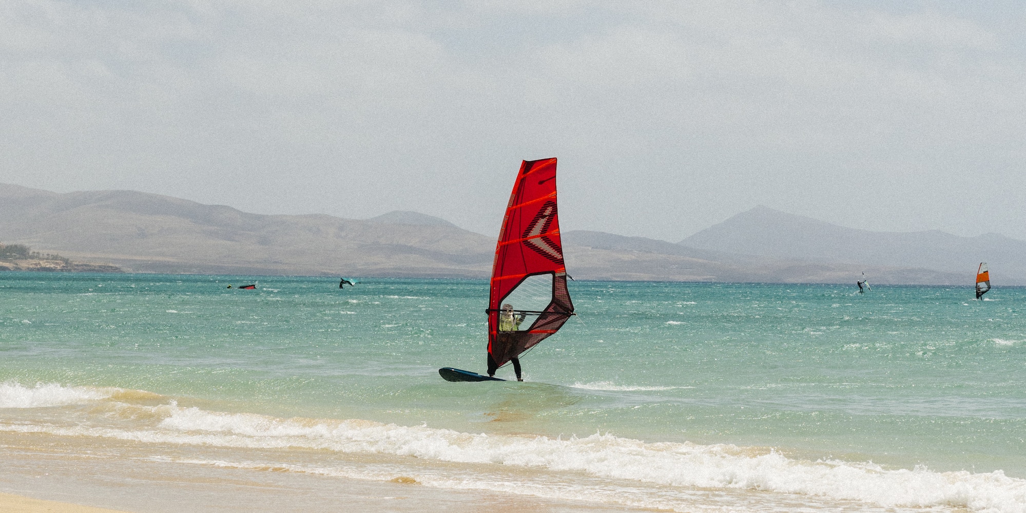 a person on a sailboat in the water