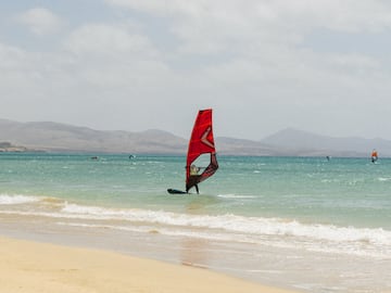 a person on a sailboat in the water