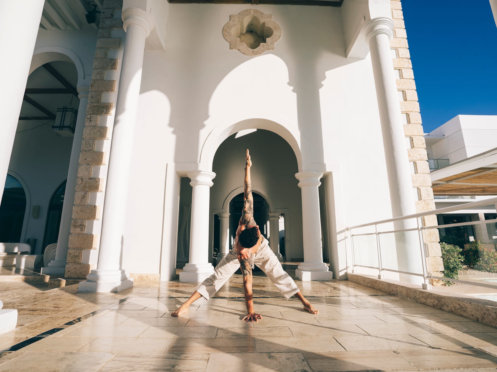 a man doing yoga outside