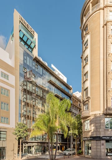 a group of buildings with trees