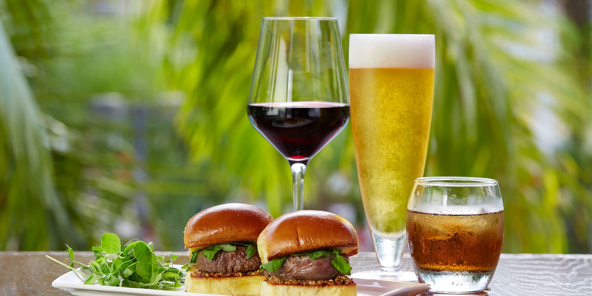 a plate of food and glasses of wine