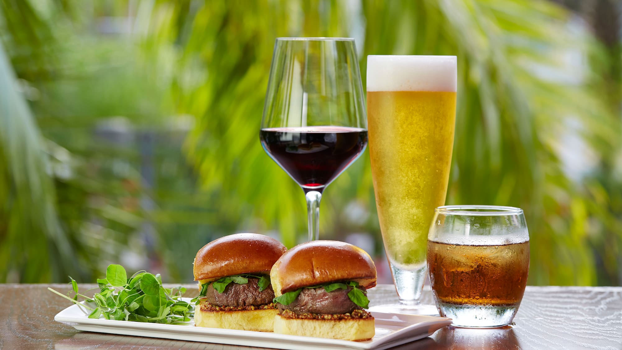 a plate of food and glasses of wine