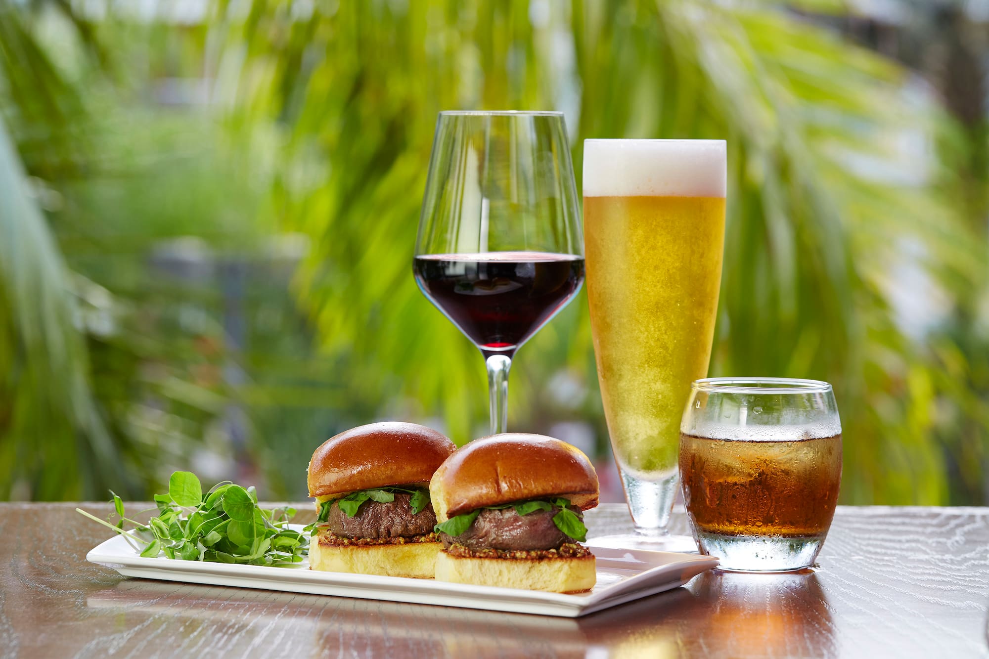 a plate of food and glasses of wine