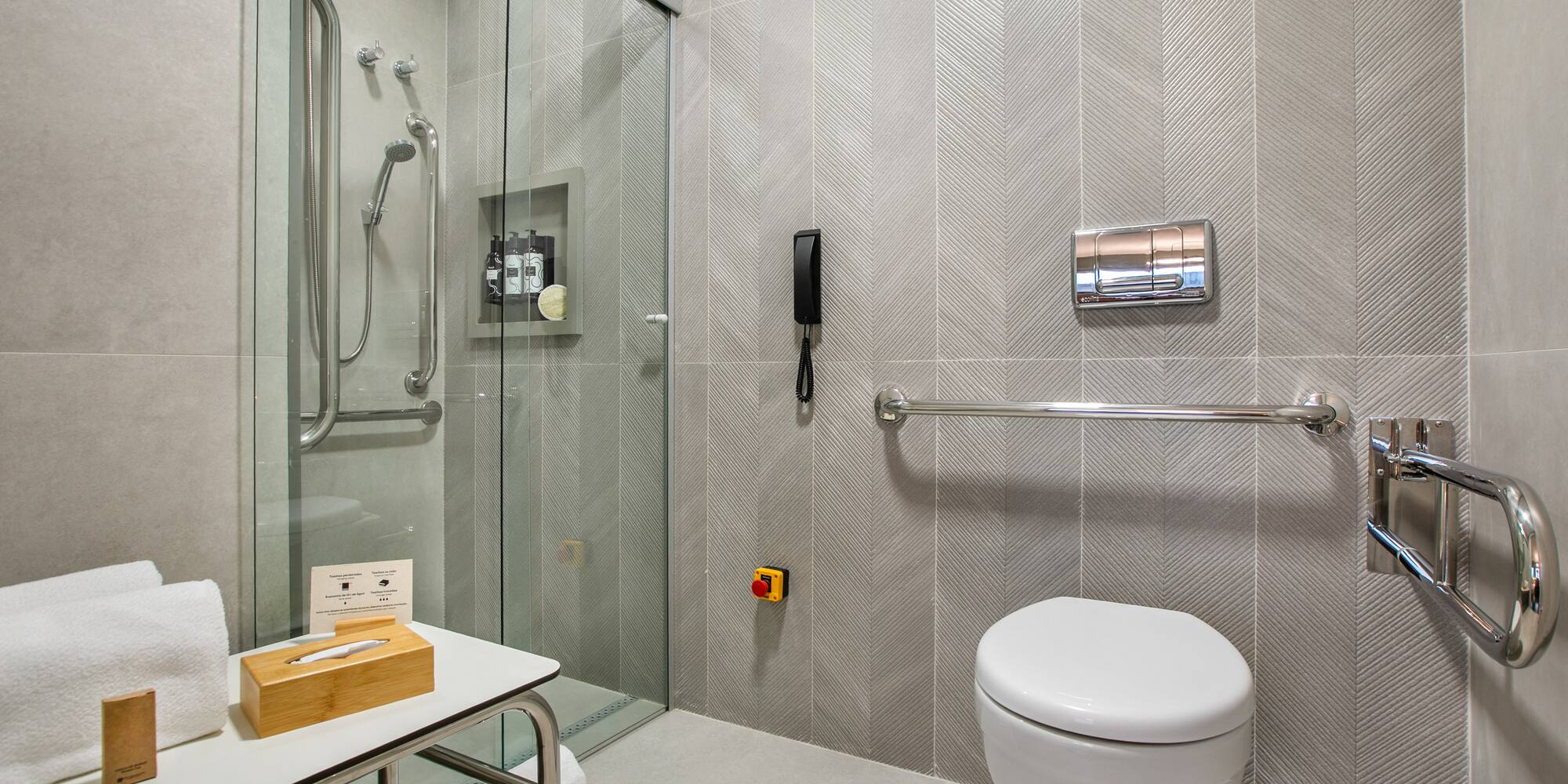 a bathroom with a glass shower door