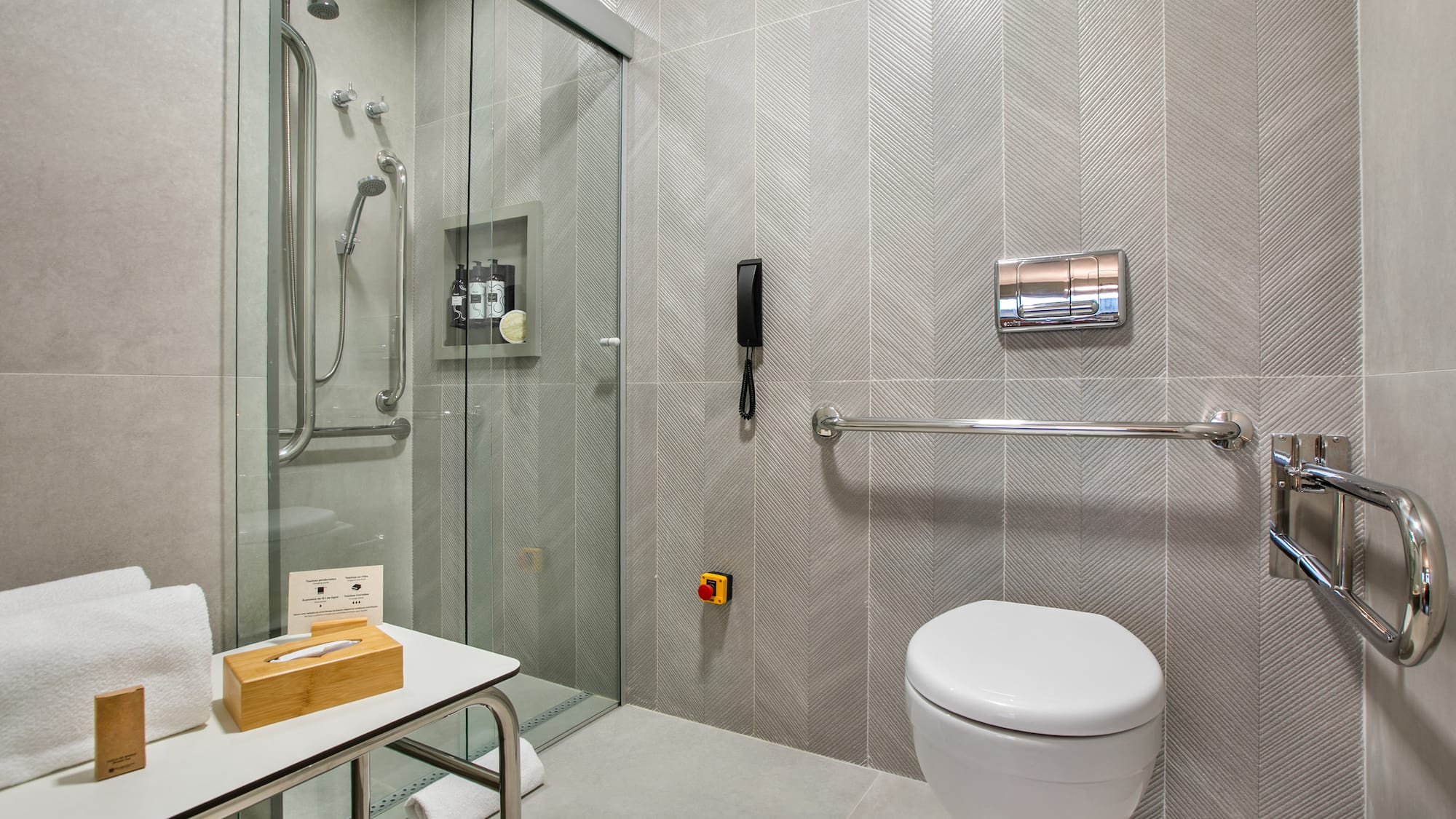 a bathroom with a glass shower door