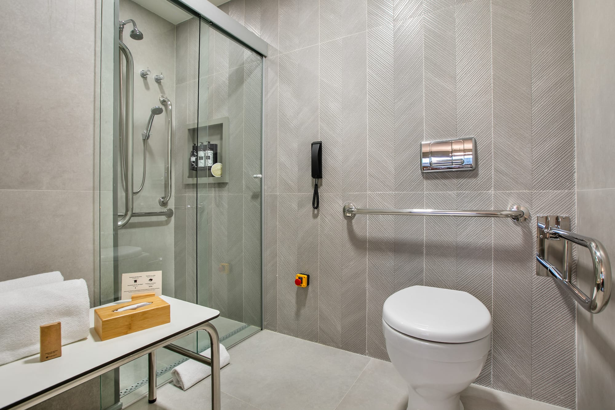 a bathroom with a glass shower door