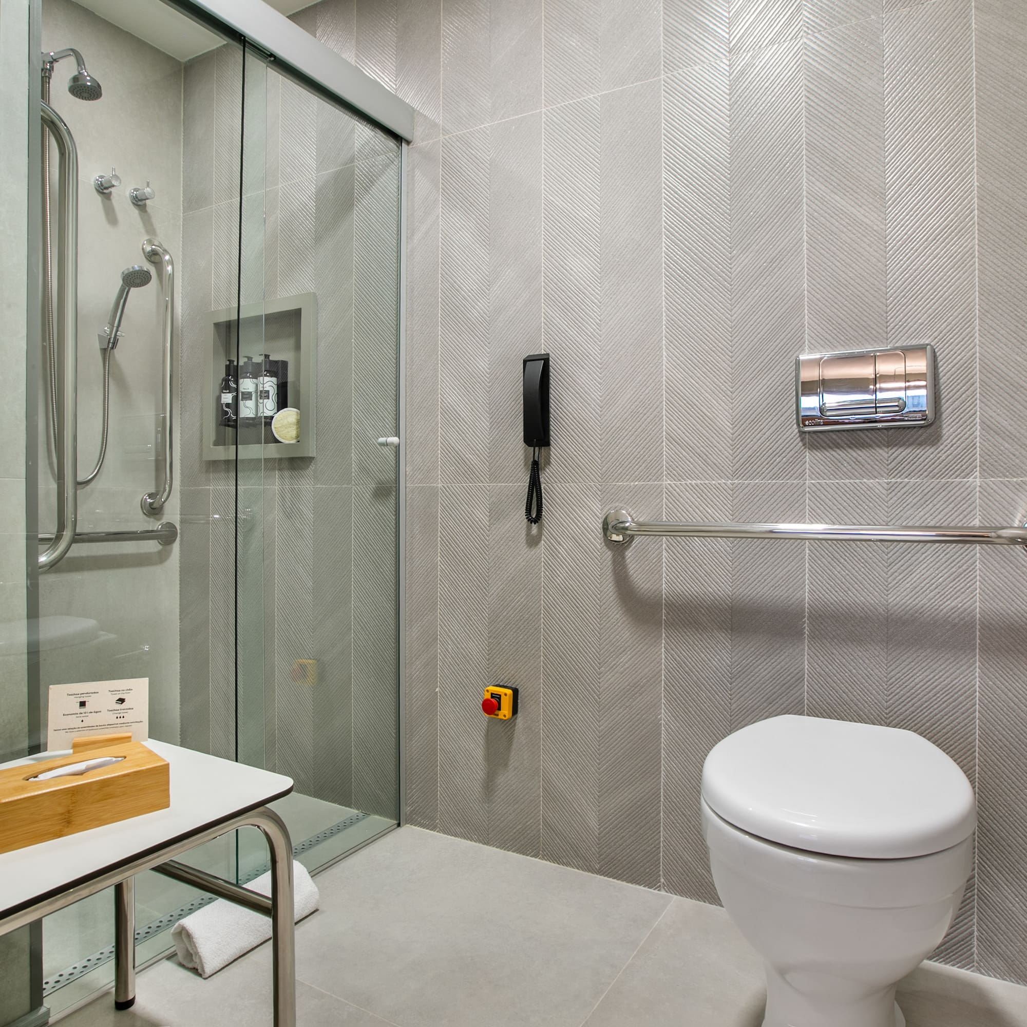 a bathroom with a glass shower door