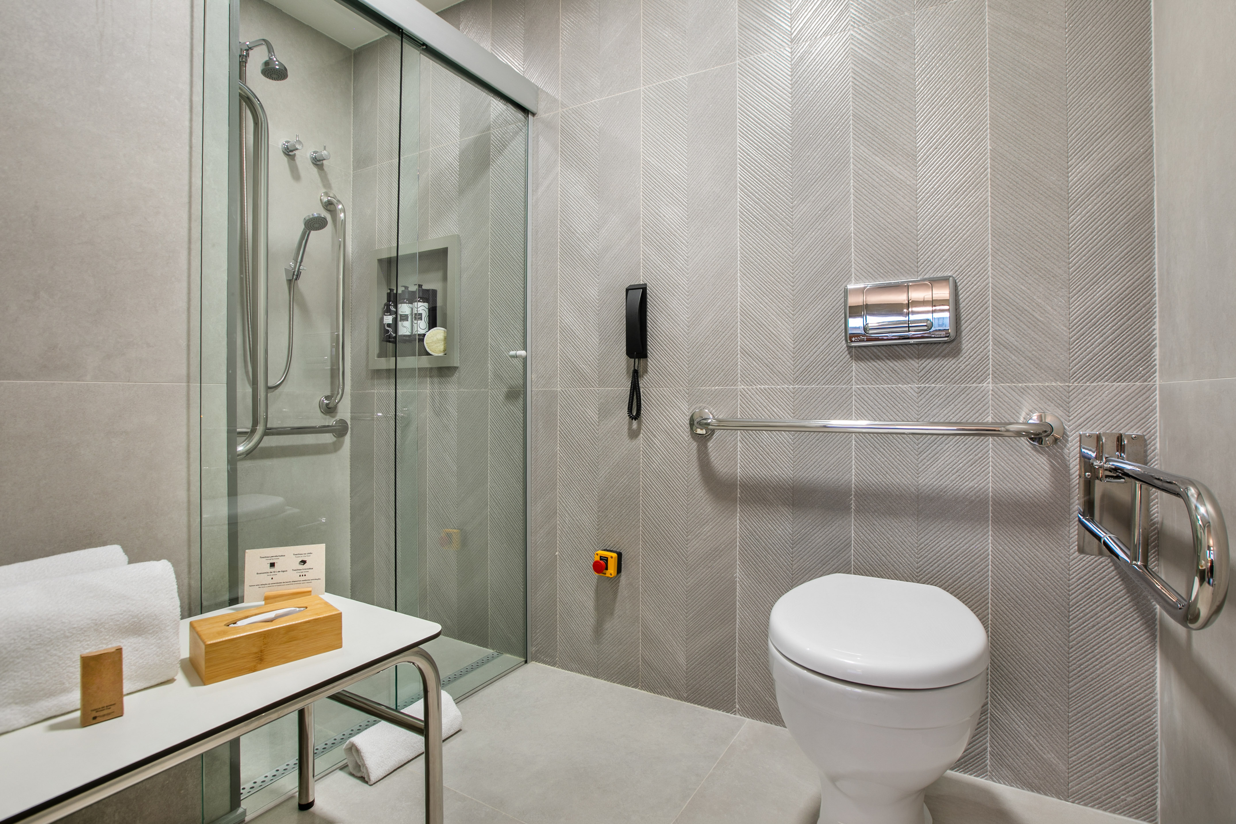 a bathroom with a glass shower door