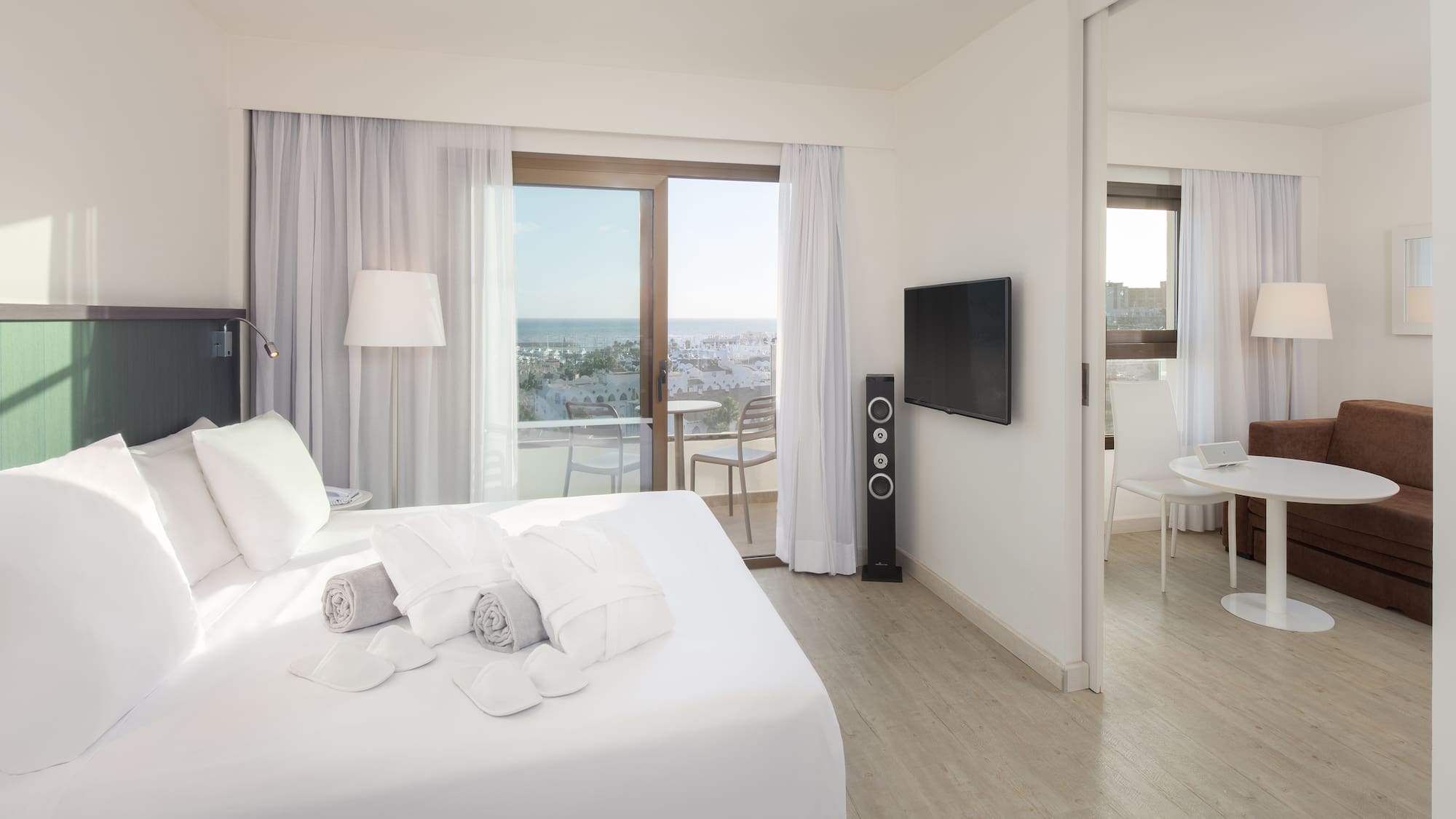 a bedroom with a large bed and a television