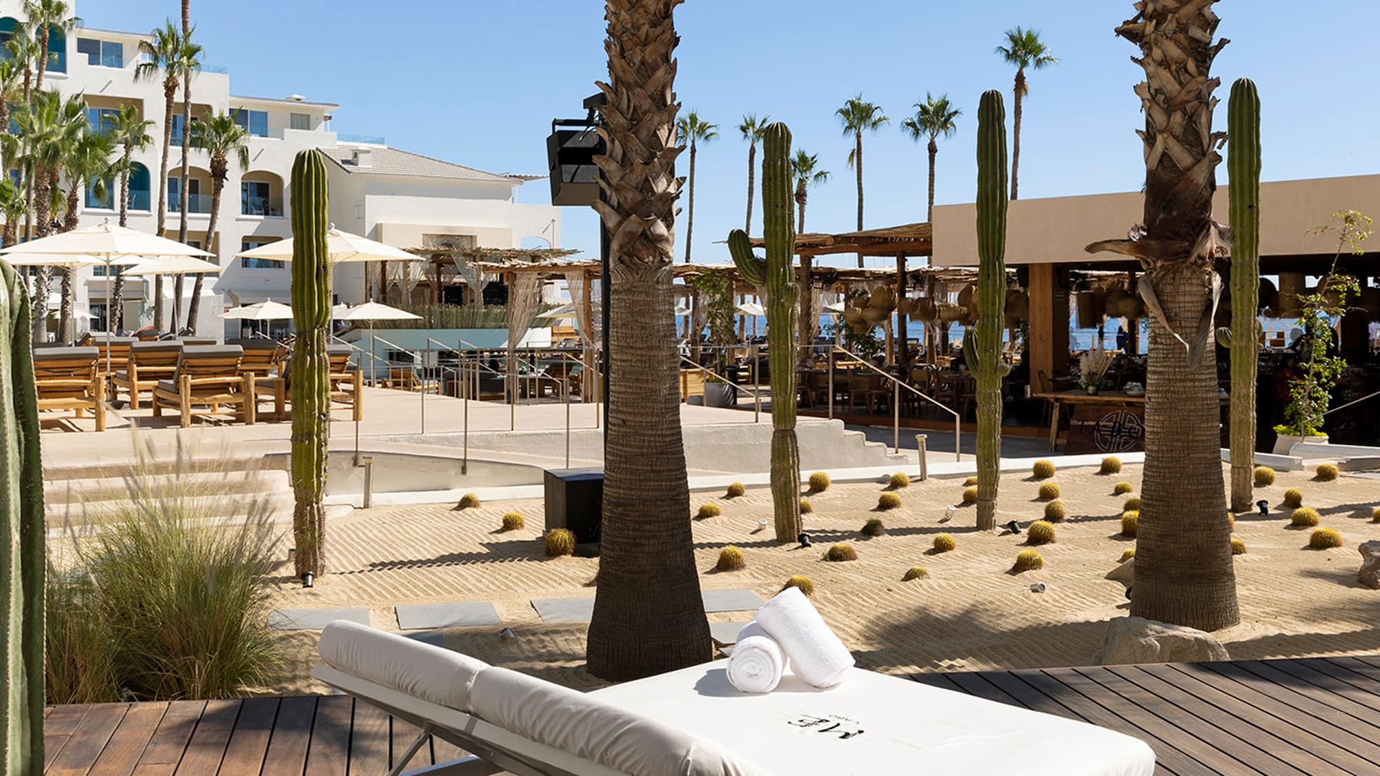 a lounge chair with towels rolled up on it