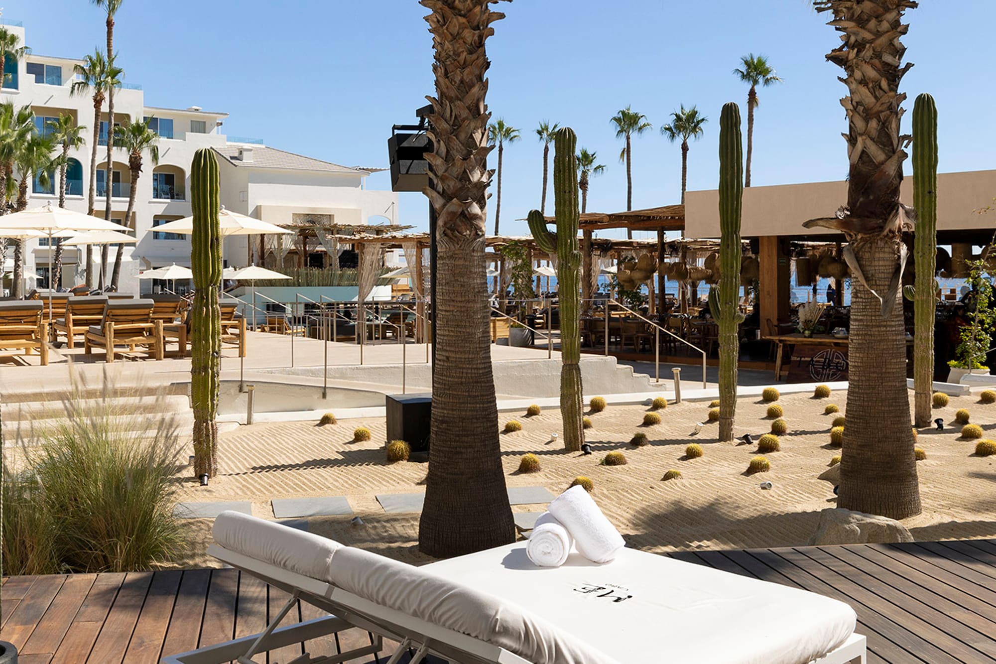 a lounge chair with towels rolled up on it