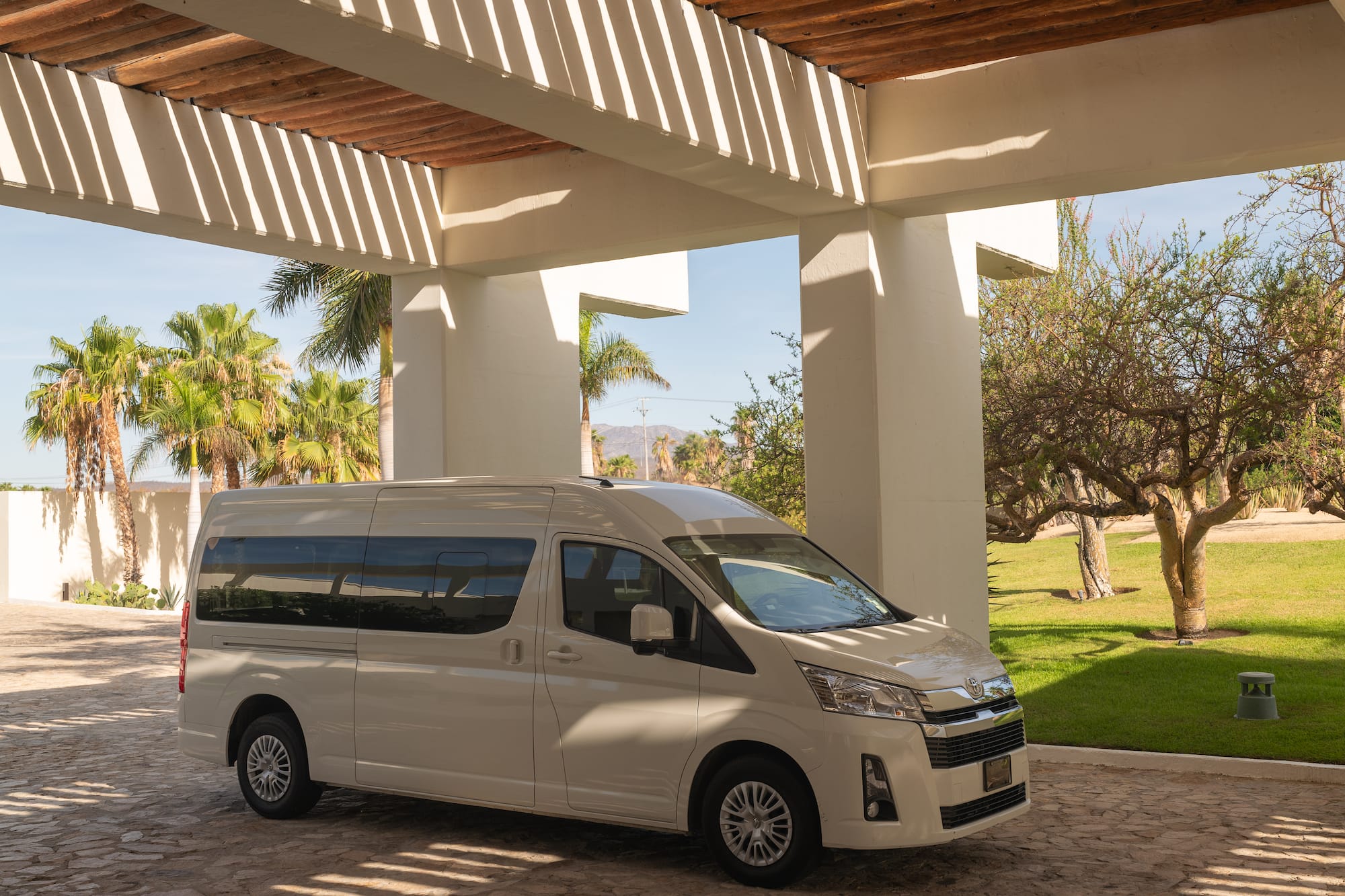 a white van parked under a covered patio