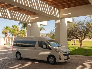 a white van parked under a covered patio